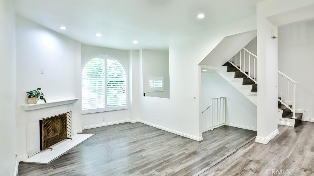 PRICED TO SELL! Discover this UPGRADED tri-level, 3-bedroom, 3-bathroom townhome in the gated community of South Bay Crest in Gardena. The first level features an attached 2-car garage with epoxy floors, overhead storage, laundry and a versatile office/den with closet. The second floor offers a bright and airy living room with fireplace, a powder room, a dining area plus a gourmet kitchen with quartz countertops, white cabinets, an upgraded refrigerator (included), gas stove and oven with access to a balcony. Upstairs, the spacious master bedroom boasts a private balcony and an upgraded full bath, accompanied by two generous bedrooms and a three-quarter bath. Notable upgrades include new vinyl wood flooring and baseboards throughout, recessed lighting in every room, quartz countertops in kitchen and all bathrooms, a tankless water heater for efficiency, a 2023 HVAC unit with 5 years of warranty remaining, washer and dryer in garage (included), abundant natural light and interior location with no street noise. Community amenities include a pool, spa, gym, tennis & basketball courts. MOVE-IN READY—don’t miss this one!