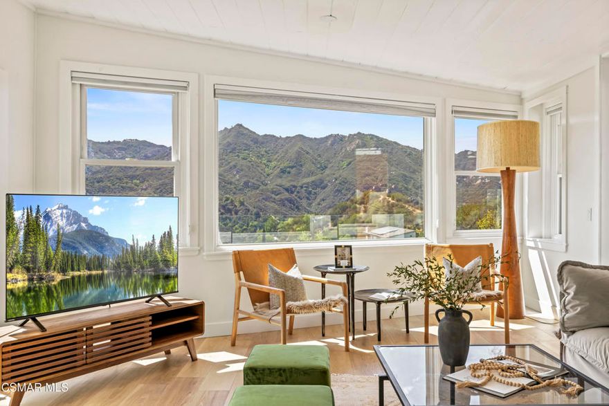 HUGE PRICE REDUCTION!!Welcome to your hidden oasis in the Santa Monica Mountains. This 3-bedroom, 2-bathroom retreat combines natural beauty with modern comfort. Just minutes from Malibu's beaches or the shops and dining of Calabasas, it perfectly blends seclusion with convenience. *Please note that we have already completed an inspection report, and have receipts to show all repairs that have been made.*In addition to the beautiful charm of this property, it also comes with modern upgrades that make this house move in ready! New copper piping and a brand new electrical panel with new wiring can give you peace of mind that this house will last. Not to mention that this house has recently had a roof tune up as well as being freshly painted. The residence features a bohemian-inspired design. Walk inside the beautiful brand new wooden doors and you are met with expansive windows that flood the interiors with light and frame sweeping mountain views. The primary suite looks directly out toward the Santa Monica Mountains, creating a tranquil backdrop to start and end your day.A spacious wraparound deck encircles the property, providing multiple outdoor living and entertaining spaces. Made from Brazilian Walnut  Wood, this deck offers some of the best protection against fires, mildew, and mold with a 40 year estimated lifespan requiring very little maintenance. Enjoy an evening under the stars with thoughtfully placed outdoor lighting, or unwind in the spa while taking in some of the area's most spectacular sunsets. This property also comes with state of the art features. Take advantage of charging your electric vehicle with a built in Tesla 220v charger. And enjoy clean drinkable water from any faucet in the house with the built in water filtration system. One of the three bedrooms is detached, offering flexibility as a private office, art studio, or music room. Whether hosting gatherings or seeking a peaceful retreat, this home offers a one-of-a-kind opportunity to experience the best of canyon living.Beyond the natural beauty, Topanga offers all the modern conveniences right in the canyon, so you rarely need to venture into the city. A local grocery store, post office, and doctor's office are just minutes away, along with yoga and Pilates studios for wellness right at your doorstep. Station 69 provides nearby fire protection, while charming restaurants and shops host live music on the weekends, fostering a vibrant sense of community. Living here means you can enjoy the best of both worlds--tranquil mountain living with everyday amenities close at hand.