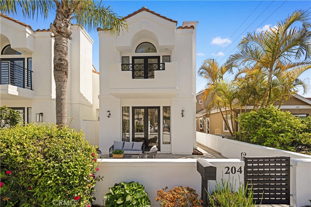 Welcome to this beautifully renovated home, featuring over $250K in upgrades! Blending modern elegance with beachside leisure, this stunning 3-bedroom, 2.5-bathroom home offers a luxurious and relaxed living experience.
Step into a sophisticated kitchen, where lavish European black up to the ceiling cabinets and a large island contrast beautifully with premium white tile flooring. Elegant pendant lights with a woven design complement the high ceilings, flooding the space with natural light and enhancing the modern beach-inspired ambiance. The kitchen is equipped with stainless steel appliances and a high-end Fotile rangehood, seamlessly connecting to a spacious backyard with low-maintenance landscaping—perfect for outdoor relaxation.
The open-concept living room extending to the front yard, showcases a Restoration Hardware chandelier, adding a touch of timeless elegance. Throughout the home, 4mm premium engineered wood flooring harmonizes with fresh Swiss Coffee white paint, creating a warm and inviting atmosphere.
A brand-new glass staircase leads to the second floor, where you'll find three spacious bedrooms, including a luxurious master suite. The master bedroom boasts a sophisticated Restoration Hardware aesthetic, complementing the completely renovated en-suite bathroom with rich natural hardwood cabinetry, a standalone soaking tub, and an upgraded modern shower—a true spa-like retreat. Step out onto your private balcony and soak in the coastal breeze. The two additional bedrooms share a beautifully updated bathroom, ensuring both style and comfort. All 3 bathrooms updated.
With new interior and exterior paint, this home is fully upgraded and move-in ready—no additional work needed! Situated in a premium beachside location, this home offers the ultimate Southern California lifestyle, where every day feels like a staycation. About 0.7 mile to the beach.
Don’t miss the opportunity to own this dream home—perfect for creating unforgettable memories with family and friends!