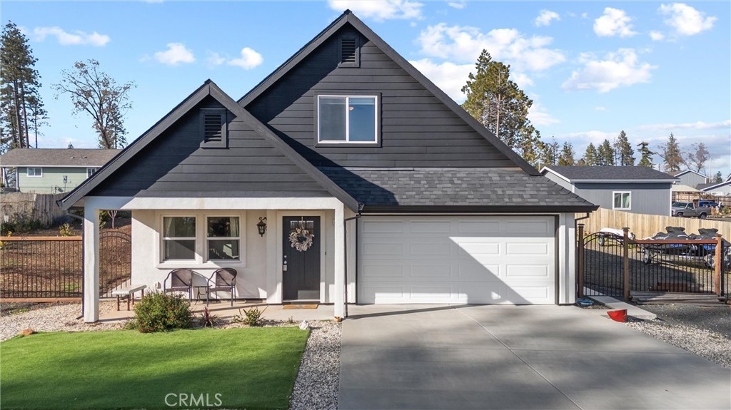 This stunning, incredibly energy efficient home features a clean and modern white and black exterior that sets the tone for luxury living. Step inside to find an inviting living room complete with a gas-lit fireplace, soaring 9-foot ceilings complemented by luxury plank flooring, and expansive windows that fill the space with natural light. The heart of the home is the exquisite kitchen, boasting solid surface quartz countertops, beautiful solid wood cabinetry, and stainless steel appliances, including a gas range. The open island design makes it perfect for gathering and entertaining. Retreat to the primary suite, where a walk-in closet and an en-suite bathroom await, featuring a dual vanity, sumptuous tub, walk-in shower and separate water closet. Upstairs, you’ll find two additional guest bedrooms, separated by a versatile 10x12 area and a guest bath. Situated on a large lot with excellent rear yard access and RV parking, this home is perfect for outdoor enthusiasts. The backyard features new fencing, sidewalks, an impressive 18x40 concrete patio, new rain gutter system, fenced-in garden area, and fruit trees.  Water lines, drip system, and electricity Additional features include a tankless hot water heater, 20 owned solar panels for energy efficiency, 220-volt power for a hot tub, and a brand new 10x12 storage building with full electricity and tool benches.  Conveniently located near Bille Park, and just 15 minutes to Chico! End your days enjoying beautiful sunsets from your own covered front porch. Don’t miss your chance to make this exceptional property your forever home – schedule a showing today!