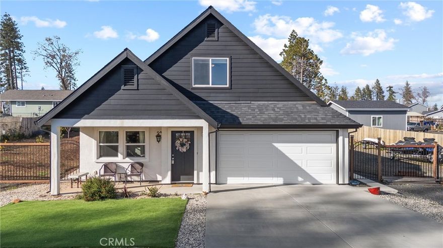 This stunning, incredibly energy efficient home features a clean and modern white and black exterior that sets the tone for luxury living. Step inside to find an inviting living room complete with a gas-lit fireplace, soaring 9-foot ceilings complemented by luxury plank flooring, and expansive windows that fill the space with natural light. The heart of the home is the exquisite kitchen, boasting solid surface quartz countertops, beautiful solid wood cabinetry, and stainless steel appliances, including a gas range. The open island design makes it perfect for gathering and entertaining. Retreat to the primary suite, where a walk-in closet and an en-suite bathroom await, featuring a dual vanity, sumptuous tub, walk-in shower and separate water closet. Upstairs, you’ll find two additional guest bedrooms, separated by a versatile 10x12 area and a guest bath. Situated on a large lot with excellent rear yard access and RV parking, this home is perfect for outdoor enthusiasts. The backyard features new fencing, sidewalks, an impressive 18x40 concrete patio, new rain gutter system, fenced-in garden area, and fruit trees.  Water lines, drip system, and electricity Additional features include a tankless hot water heater, 20 owned solar panels for energy efficiency, 220-volt power for a hot tub, and a brand new 10x12 storage building with full electricity and tool benches.  Conveniently located near Bille Park, and just 15 minutes to Chico! End your days enjoying beautiful sunsets from your own covered front porch. Don’t miss your chance to make this exceptional property your forever home – schedule a showing today!