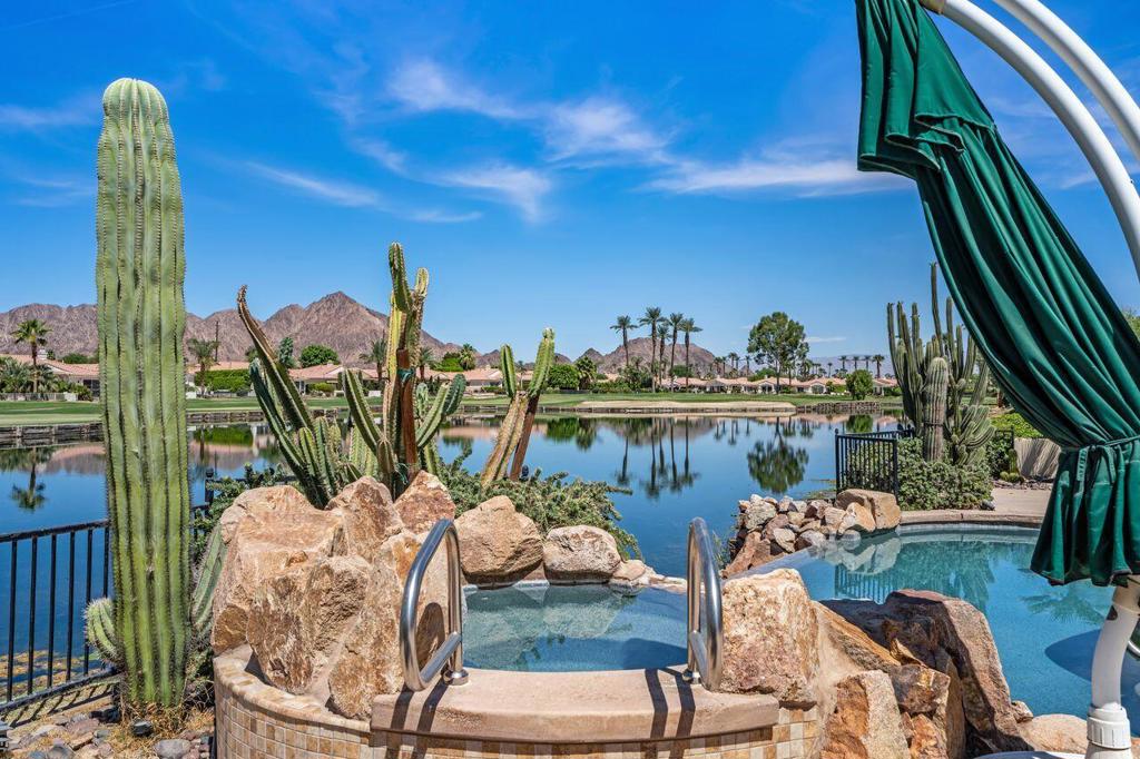 Luxury Golf Course Living in Prestigious La Quinta Fairways - Your Dream Home Awaits! Welcome to this stunning 3-bedroom, 3.5-bathroom residence in the exclusive La Quinta Fairways gated community, where breathtaking golf course, lake, and mountain views create a serene desert paradise. Spanning 2,756 sq ft on a spacious 10,019 sq ft lot, this meticulously maintained home (built in 2000) offers an exceptional attached casita layout--perfect for guests, multi-generational living, or a private home office. Unparalleled Location on the PGA West Dunes Course Situated on the legendary PGA West/La Quinta Resort Dunes Course, designed by golf icon Pete Dye, this home is a haven for golf enthusiasts. Step outside to sweeping fairway vistas, tranquil lake waters, and the majestic Santa Rosa Mountains--all from the comfort of your own backyard. Elegant Interior with Modern Upgrades Inside, you'll find a freshly painted interior with new carpet, a bright and inviting morning room overlooking a charming front courtyard, and an open layout designed for effortless entertaining. The home also features: - Wet bar for seamless hosting - Newer HVAC system for year-round comfort - Generac generator ensuring uninterrupted power - Owned solar panels for energy efficiency and savings Resort-Style Outdoor Living The backyard is a true oasis, where an infinity-edge pool appears to merge with the adjacent lake, creating a breathtaking visual effect. Whether lounging poolside, dining al fresco, or enjoying the peaceful desert evenings, this space is designed for relaxation and luxury. Low HOA with Premium Amenities The HOA covers front landscaping, tree trimming, cable TV, internet, and trash, making maintenance effortless. Plus, electric service is provided by cost-conscious IID, keeping utility bills affordable. Exclusive Membership Opportunities As a resident, you'll have access to membership opportunities at: - La Quinta Resort & Club - World-class spa, dining, and golf - The Citrus Club - Private social club with premier amenities - PGA West - Legendary golf courses and elite events Your Desert Retreat Awaits This home is more than just a residence--it's a lifestyle. With its prime location, stunning views, and resort-quality features, it's the perfect blend of luxury and comfort. Don't miss this rare opportunity to own a piece of La Quinta's most coveted golf community!