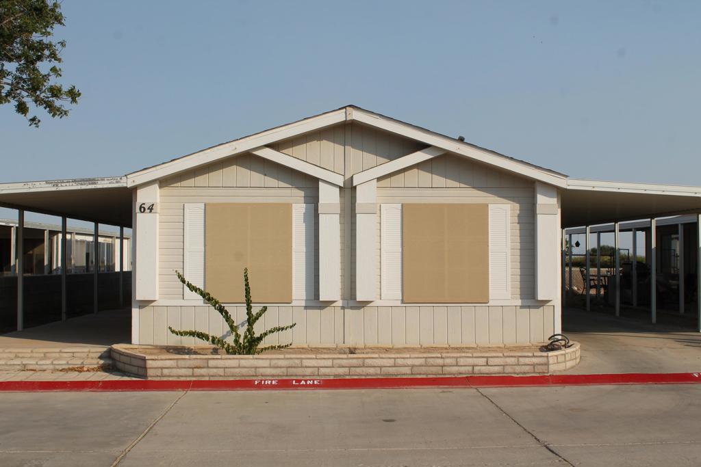Updated manufactured home with an open concept and newer appliances. 2 bedrooms and 2 full bathrooms. Storage shed included, and a partial view of hole #16 and the lake. Great value and access to the pool! Dont wait on this one! Priced to sell.