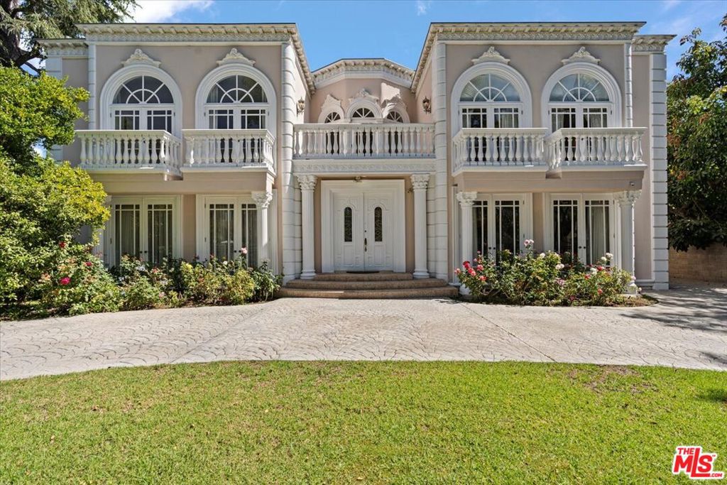 Welcome to an exquisite residence nestled in the prestigious Beverly Hills neighborhood The Flats. This iconic address offers the epitome of luxury, elegance, and sophistication. Step into a world of refined elegance with this beautifully designed home. The grand entrance opens to spacious living areas adorned with high ceilings, intricate moldings, and stunning finishes that exude timeless charm. Upstairs, the primary suite is a private oasis, complete with a lavish en-suite bathroom, walk-in closets, and a serene ambiance. Additional bedrooms are generously sized, each offering comfort and style. Experience the quintessential California lifestyle with seamless indoor-outdoor living. The meticulously landscaped backyard boasts a sparkling pool and ample space for al fresco dining and relaxation. Situated in the heart of Beverly Hills, this property offers unparalleled access to world-class shopping, dining, and entertainment. Enjoy the convenience of being just moments away from the iconic Rodeo Drive luxury shopping, fine dining, and other renowned attractions.
