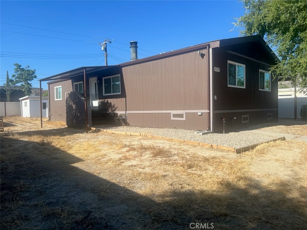 This beautifully updated 4-bedroom, 2-bath manufactured home spans 1,152 sq ft and sits on a generous 0.2-acre lot in Hemet. Built in 1982 on a permanent foundation, it offers both space and lasting stability. Ideal for families seeking room to grow, the property provides ample space for vehicles, tools, and hobbies—all on a private, well-maintained lot.
Upgrades include a new roof, fresh interior and exterior paint, vinyl fencing, modern kitchen cabinetry, updated flooring, a brand-new air conditioning system, an upgraded septic tank, electrical, plumbing, renovated bathrooms, and a newly installed carport.
