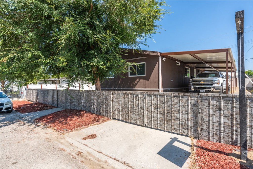 This beautifully updated 4-bedroom, 2-bath manufactured home spans 1,152 sq ft and sits on a generous 0.2-acre lot in Hemet. Built in 1982 on a permanent foundation, it offers both space and lasting stability. Ideal for families seeking room to grow, the property provides ample space for vehicles, tools, and hobbies—all on a private, well-maintained lot.
Upgrades include a new roof, fresh interior and exterior paint, vinyl fencing, modern kitchen cabinetry, updated flooring, a brand-new air conditioning system, an upgraded septic tank, electrical, plumbing, renovated bathrooms, and a newly installed carport.