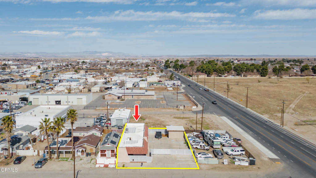 Tremendous opportunity in the heart of Lancaster's commercial/industrial district! Located just a short distance from the bustling ''Blvd'' area, this property consists of a 7,000+ sq. foot lot, a 2,290 sq. foot building, and a large outdoor storage shed. It is located within Lancaster's ''T.O.D'' Zone, allowing for a variety of different uses (retail, commercial, office space, light industrial, and much more!). The majority of the property is fully fenced, with a few parking spaces in front, and several more within the fenced area. The main building is comprised of a large, open room with multiple doors, allowing the possibility to divide in to different rentable suites. There are also 2 restrooms, some additional office/reception areas, and a space that would be ideal for a break room or kitchen. There is fresh paint throughout the interior of the building, and the electrical panel is brand new! The storage outbuilding, and the steel gate & fence were both built less than 5 years ago! Division Street is an eyeshot away, offering road frontage to thousands of cars per day! This property is extremely unique, versatile, and offers many possibilities for developers, businesses looking to establish a storefront, or investors looking for a 1031 exchange property. Come take a look before it's gone!