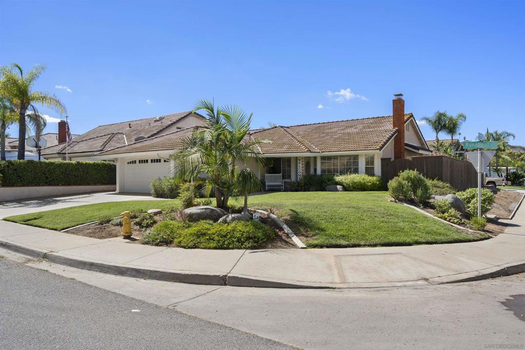 This is the home you've been waiting for. Better than new, this stunning one-story floor plan sits on a coveted corner lot in a quiet cul-de-sac, offering a range of modern upgrades inside and out. Highlights include a new concrete and clay tile roof, an energy-efficient HVAC system with both electric and gas heating options, an electric water heater, rain gutters, an insulated garage door, and much more. Plus, the OWNED 24-panel solar system keeps your energy costs to a minimum, with low electric bills that are passed on to the buyer at no extra cost. Inside, you'll find brand-new flooring throughout, a fully remodeled kitchen with sleek new cabinets, gorgeous granite countertops, and a complete transformation of the home with removed acoustic ceilings, retextured walls, fireplace, and stylish recessed lighting. All the bathrooms have been updated with modern vanities, faucets, and lighting, and the bedrooms have fresh carpeting and new closet doors. Step outside to enjoy the beautifully landscaped, virtually maintenance-free front and backyard, complete with pavers, five storage sheds, a full-length patio, an entertainment area with a covered patio, lighting, an outdoor TV, and a built-in barbecue perfect for hosting. The fully fenced yard offers the privacy you won’t find in many other homes, with the corner lot adding even more seclusion. Just a short stroll away, Woodhaven Community Park is perfect for dog walks, family outings, and stretching your legs. The home is also just minutes from schools, shopping centers, restaurants, freeways, Cuyamaca College, and more. This is the home you've been waiting for. Better than new, this stunning one-story floor plan sits on a coveted corner lot in a quiet cul-de-sac, offering a range of modern upgrades inside and out. Highlights include a new concrete and clay tile roof, an energy-efficient HVAC system with both electric and gas heating options, an electric water heater, rain gutters, an insulated garage door, and much more. Plus, the OWNED 24-panel solar system keeps your energy costs to a minimum, with low electric bills that are passed on to the buyer at no extra cost. Inside, you'll find brand-new flooring throughout, a fully remodeled kitchen with sleek new cabinets, gorgeous granite countertops, and a complete transformation of the home with removed acoustic ceilings, retextured walls, fireplace, and stylish recessed lighting. All the bathrooms have been updated with modern vanities, faucets, and lighting, and the bedrooms have fresh carpeting and new closet doors. Step outside to enjoy the beautifully landscaped, virtually maintenance-free front and backyard, complete with pavers, five storage sheds, a full-length patio, an entertainment area with a covered patio, lighting, an outdoor TV, and a built-in barbecue perfect for hosting. The fully fenced yard offers the privacy you won’t find in many other homes, with the corner lot adding even more seclusion. Just a short stroll away, Woodhaven Community Park is perfect for dog walks, family outings, and stretching your legs. The home is also just minutes from schools, shopping centers, restaurants, freeways, Cuyamaca College, and more. Rancho San Diego is an outdoor enthusiast's dream, with parks, golf courses, hiking, biking, and horseback riding trails close by. Plus, you'll be near East County's lakes, campgrounds, and casinos. This is a turnkey home that truly has it all—don't miss out Unique remodeled one story sitting on corner parcel in quiet private cul-de-sac setting. Includes new concrete tile roofing, OWNED 24 panel solar system, new energy efficient HVAC heat/air system, completely renewed kitchen & baths, new flooring throughout, acoustic ceilings with recessed lighting, dual wood & gas burning fireplace, open concept floorplan with architectural nuances, EV charging system & much more. Entertainer & gardeners delight with fully fenced yard, outdoor television, natural gas built-in Bar-B-Q grill, two benc...