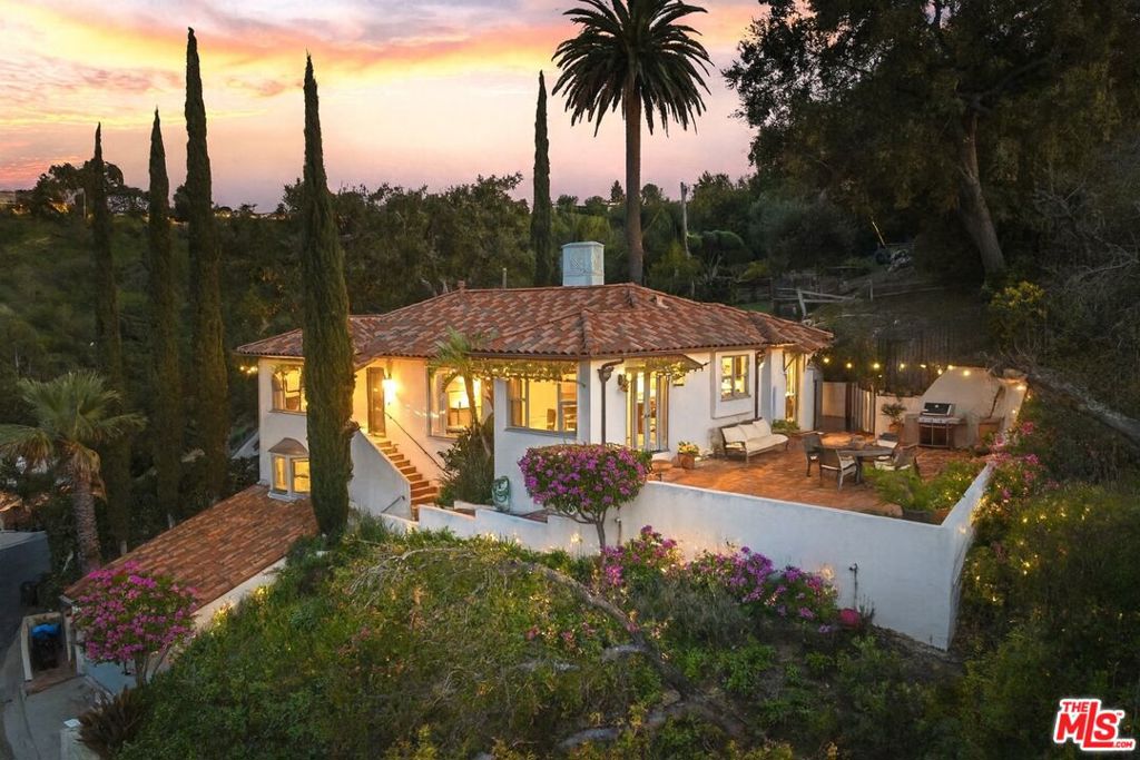 If you love VIEWS, PRIVACY & USABLE LAND, this is the home for YOU! Welcome to this warm & wonderful 3 bedroom, 2 bathroom Spanish-style residence set in the prestigious hills of Sherman Oaks. Perched high on a 13,410 sq ft lot, this special home offers SWEEPING CITY & MOUNTAIN VIEWS WITH RARE & UNPARALLED PRIVACY. Classic details include hardwood floors, two fireplaces, and a wonderful, light filled cook's kitchen that flows to an enormous and ENTIRELY PRIVATE terra cotta terrace with breathtaking VIEWS in all directions! The expansive backyard WITH SWEEPING VIEWS backs up to protected open space parkland and offers a rare opportunity to create a custom, extremely private retreat with space for a pool, cabana, and ADU (plans included). Versatile lower-level suite, previously with a private entrance and kitchenette (and easy transition back) is ideal for guests or extended family. Spacious 2 car garage. This special home is just a few steps to the spectacular Deervale Trail and is close to everything! CALIFORNIA LIVING AT IT'S BEST!