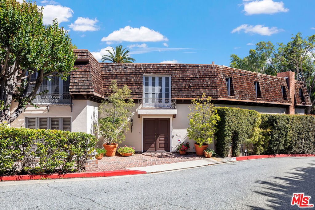 Nestled on one of Beverly Hills' most coveted streets, this classic French-style estate designed by Bud Holden presents an incredible opportunity to create your dream home. Just a short stroll from the iconic Beverly Hills Hotel, this 6-bedroom, 7-bath residence spans over 5,800sf of timeless character and potential. With grand living spaces, original architectural details, and an expansive lot, this home is perfect for those looking to restore its historic charm or reimagine it into a modern masterpiece. The lush grounds offer plenty of space for outdoor living, whether you envision a tranquil garden retreat or an entertainer's paradise. A rare chance to own a piece of Beverly Hills history in an unbeatable location - bring your vision and make this extraordinary property your own.