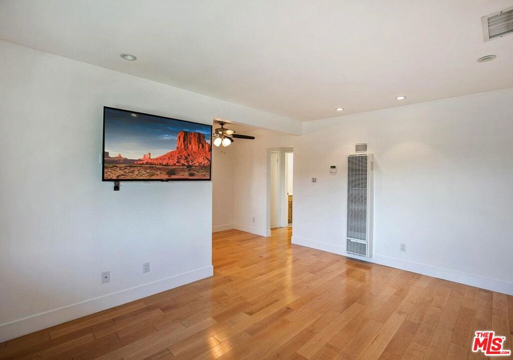 Step into beachside bliss in this sun-drenched upper-level residence, just steps from the sand on one of Venice's most iconic walk streets. Nestled in a beautifully maintained mid-century garden-style building, Unit E offers the perfect blend of classic charm and modern comfort. This 1-bedroom, 1-bath unit is filled with natural light from oversized windows and enjoys refreshing ocean breezes year-round.The inviting open floor plan features hardwood floors, a well-appointed kitchen, generous storage, and a serene bedroom retreat. Step outside to a lush shared courtyardideal for morning coffee, alfresco dining, or simply unwinding after a beach day. Enjoy the rare tranquility of a car-free path at your doorstep, while being moments from the vibrant energy of the Venice Boardwalk, Abbot Kinney, Erewhon, Whole Foods, Kreation, Rose Ave Main Street and a stones throw from THE BEACH. With private entry, community laundry, and assigned parking, this is coastal living at its finest effortless, stylish, and inspiring. Whether you're looking for your own sanctuary or a pied--terre by the Pacific, this is your chance to live the Venice dream.