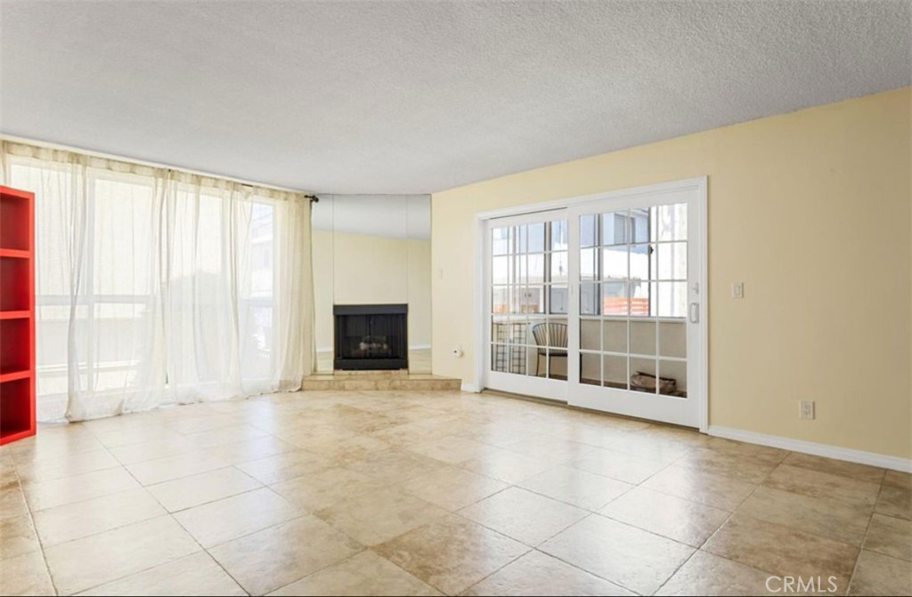 Prime North of Wilshire Location – 3-Bed, 2-Bath Condo
Located in one of Santa Monica’s most desirable neighborhoods, just a 20-minute walk to the beach and three blocks from Montana Ave. shops and restaurants. This spacious single-level condo features a custom kitchen (remodeled in 2016) with lacquer cabinets, stone counters, stainless appliances, soft-close drawers, and a large pantry with roll-out shelves. Dining area includes a custom bar with wine fridge and privacy-tinted window.
The living room offers tile floors, a fireplace, and sliding doors to a large enclosed balcony—perfect for outdoor dining. The primary suite features a fully remodeled bath (2019), custom closet, Biobidet toilet, and dual shower heads. Two additional bedrooms include walk-in closets and are ideal for guest space, home office, or media room.
Other highlights: second balcony, smoke alarms, elevator access to two tandem parking spaces and storage locker. Inside laundry allowed, low HOA dues in a well-maintained building. Walk to Whole Foods, Trader Joe’s, Target, Reed Park, The Broad Stage, and more. Easy access to public transit and located in the Roosevelt School District.