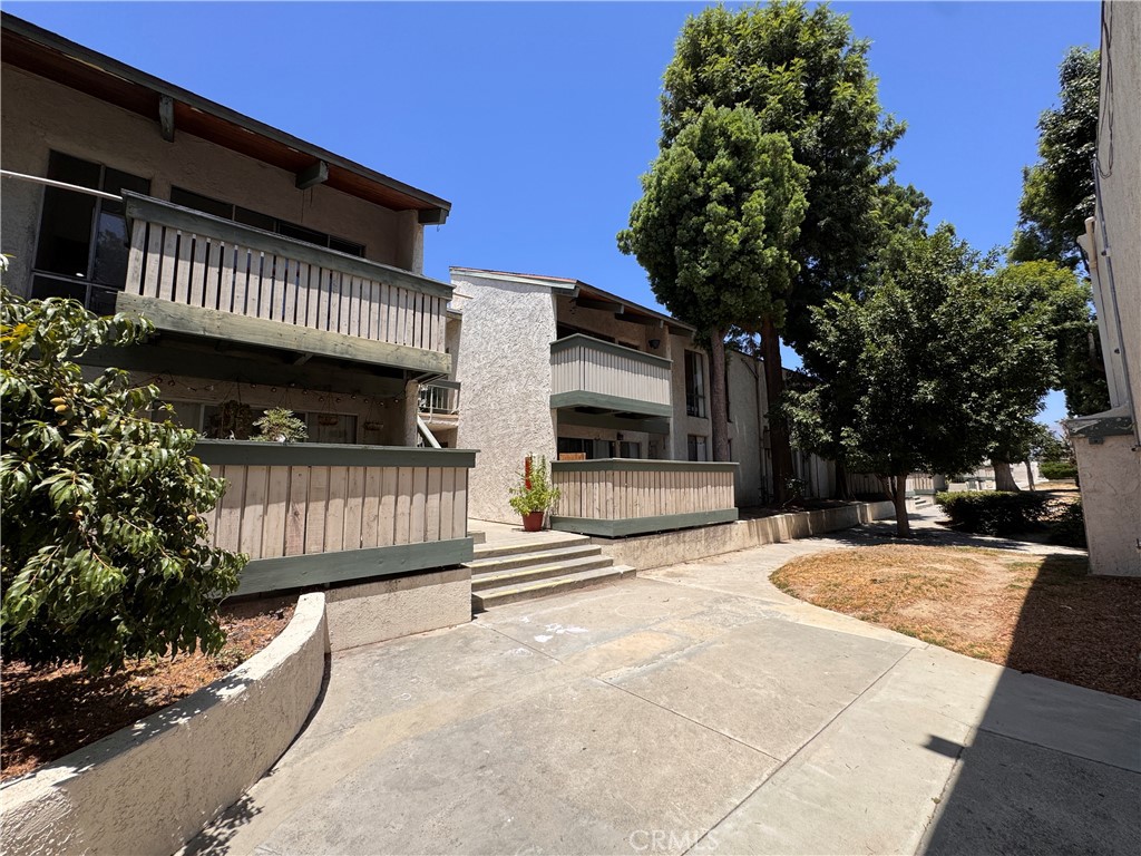 This bright upper-level condo in the Villa Park community offers a spacious and well-designed floor plan just steps from the park. Featuring vaulted ceilings, a large living room with a private balcony, and a separate dining area, the home includes two bedrooms and one bathroom. Recent updates include a remodeled kitchen with granite countertops, an upgraded bathroom with a new vanity, Nest thermostat, fresh paint throughout, and central A/C. The primary bedroom features a walk-in closet. The gated community provides secured entry, a sparkling pool, spa, clubhouse, BBQ area, greenbelt, and on-site laundry. One assigned parking space is included, with additional spots available for lease through the HOA. Gas and water are covered in the monthly dues. With easy access to freeways, public transit, Westfield Mall, and The Village, this is a fantastic opportunity for investors.