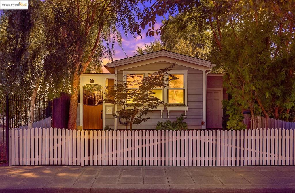 ADORABLE cottage inside and out. Beautiful high wood ceilings in the open concept living/dining/kitchen space. Primary bedroom and bath in rear of house with views of private and small charming back yard. Second bedroom in front with bath just steps away. A great separation of bedroom spaces with the combined common area in middle. Parking off street behind white picket fence in front yard - or just park on street. French doors open to charming side deck . Convenient and large storage area accessible from deck and from front of house. Great space to store bicycles, canoes, whatever extra storage needs you have. Location is Walkers' and Bikers' paradise - Score of 94. Plenty of restaurants and shops to visit. Have you tried 900 Grayson Cafe for breakfast?!! Or Doyle St Cafe ? Neighborhood favorites!