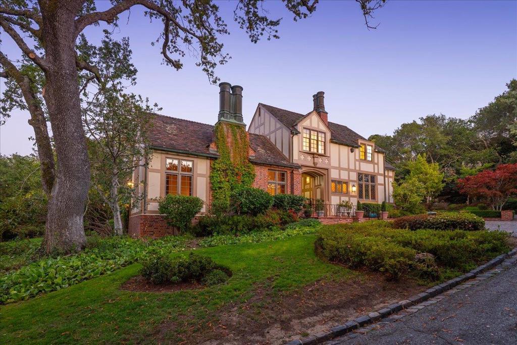 For the very first time in its storied history, this 1936 family estate is being offered to the public. This classic English Tudor is a landmark in its own right, a home that gracefully bridges Hillsborough's past and present. Set on nearly an acre of level land with views of the Bay and San Francisco skyline, the residence embodies timeless elegance. Its centerpiece is a remarkable floating spiral staircase anchored only at the bottom and top. With a large open kitchen connecting to the family room, plus 5 bedrooms and 5 full bathrooms (2 half baths), the estate is ready and waiting for its next owner (some photos are virtually staged)! There is a bedroom, library and full bathroom on the main level. The primary bedroom and 3 add'l bedrooms are upstairs. Outdoors, the gardens carry the signature of renowned landscape architect Thomas Church, whose designs shaped much of California's most beautiful private estates with broad lawns, graceful plantings and private spaces. Built by the Wisnoms, one of the founding families of San Mateo, The National Bank of San Mateo and cousins of Wisnoms Hardware family. This offering represents a rare opportunity: to own a piece of Hillsborough history and to become the next steward of a home designed with both legacy and livability at its core.