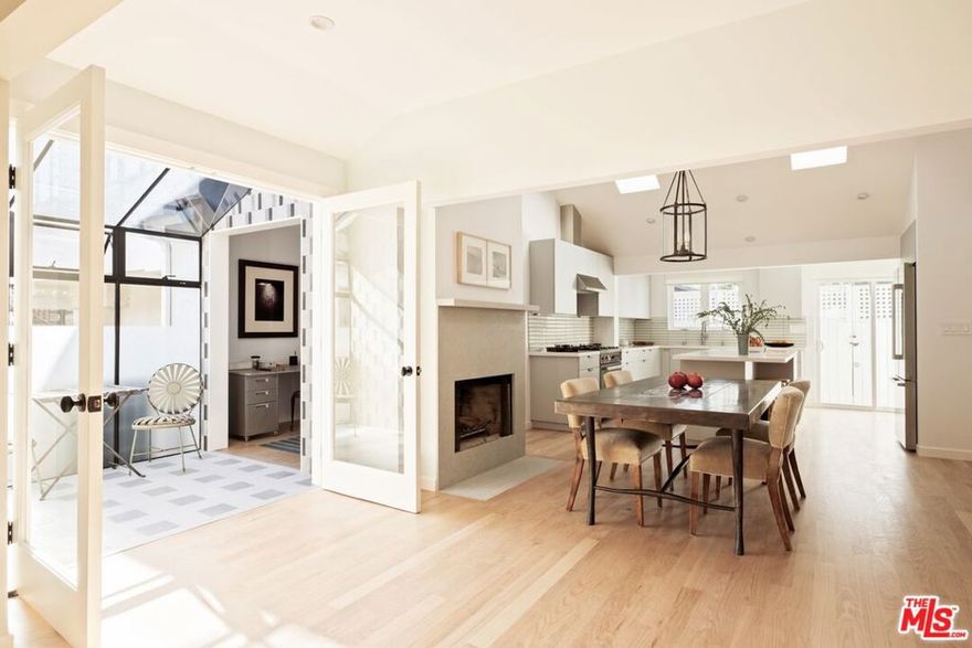 Nestled in Venice's coveted Presidents Row, where homes rarely become available, this newly completed, thoughtfully renovated, and never-lived-in residence blends modern luxury with tasteful, designer finishes. Inside, premium-grade red oak flooring, vaulted cathedral ceilings, six skylights, and two fireplaces illuminate the open layout with natural light, creating a warm and inviting ambiance. Spanning 1,660 square feet, this home features three bedrooms, two bathrooms, a one-car garage, and additional gated parking for two vehicles. The culinary enthusiast's kitchen boasts custom cabinetry, quartzite countertops, brand-new appliances from Bertazzoni, Bosch, and Miele, fixtures by Kohler, and Inax-Izumi ceramic tile, all complementing the home's refined aesthetic. A sunlit atrium adorned with porcelain designer tiles invites a connection to nature and offers a serene retreat. Following a complete renovation, the home includes a new HVAC system, tankless water heater, upgraded insulation, new electrical and copper plumbing, dual-pane windows, and is EV-ready. The high-end finishes, coupled with the home's numerous upgrades, provide long-term peace of mind to the new homeowner. Situated on a LAR2 lot, this property also offers a rare opportunity to create a one-of-a-kind Venice compound with the adjacent home also available (price upon request). Moments from Abbot Kinney, the beach, Coeur d' Alene Elementary, and located in one of Venice's most community-focused neighborhoods, this is an opportunity not to be missed!