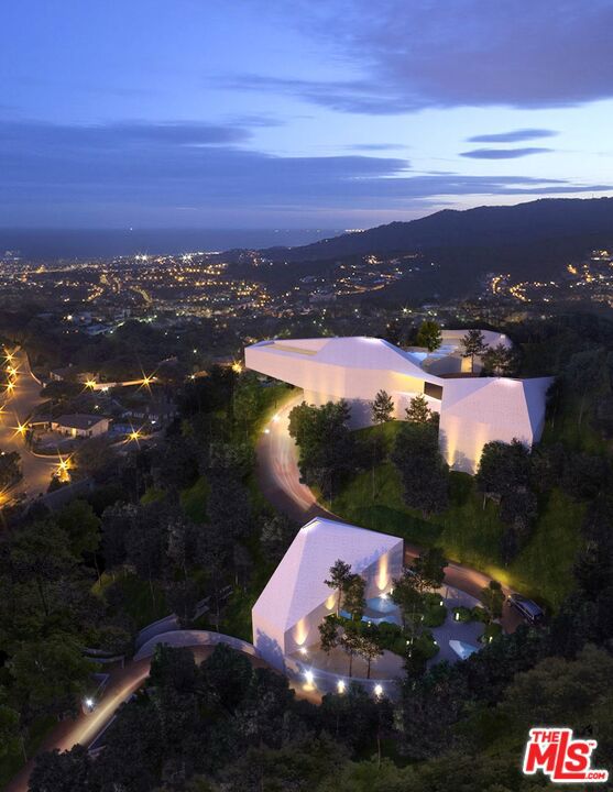 Strategic investment opportunity in the heart of the Hollywood Hills. Offered for the first time in decades, this ultra-private, gated estate represents a rare chance to acquire one of the largest and last developable parcels in the core of the Hollywood Hills. Totaling approximately 2.5 acres of buildable flat and gently sloped land, the property combines location, scale, and historic pedigree making it a premier trophy asset. Fully executed architectural (Baumschlager Eberle/ SPF:a Studio Pali Fakete) plans available and a lot line adjustment nearly complete; dividing the lot into two parcels, lower and upper. Located just above Sunset Boulevard in the Hollywood Foothills, adjacent to Runyon Canyon and Wattles Park estate, offers protected greenbelt surroundings, panoramic 360-degree views, and seamless access to both central Hollywood and the Westside. This unique blend of privacy, views, and centrality is increasingly rare and virtually impossible to replicate under current zoning and topographical constraints. The estate includes a lot line adjustment with two parcels, each offering expansive city views and discreet access. Together, they present a compelling value-add opportunity to build a landmark luxury compound on one of L.A.'s largest contiguous residential lots, develop two premier view estates with exceptional resale potential, create an income-producing live/work artist retreat or creative campus, or establish a private family estate or trust-held generational asset with long-term appreciation potential. Originally built in 1923, the existing Andalusian-style structure totals approximately 5026 sf and was previously owned by screen legend Raymond Burr and later music executive Miles Copeland III. While the home may no longer meet modern standards, it provides an architectural footprint and historic narrative that may support rehabilitation tax incentives, or luxury adaptive reuse strategies. Two legal parcels offer flexibility for dual development. The property has an entitlement history that includes multiple historic permits for retaining walls, greenhouse structures, and auxiliary buildings. Inventory of large hillside development sites with flat pads and city/ocean views is virtually nonexistent. Exit strategies include custom resale, spec luxury homes, family compound, or long-term land banking. Structure: 8,697 sq ft (combined square footage of main house (5,026 +sq ft) and auxiliary structures - all tear-down or renovation candidates). Parcels: Approx. 1 acre + 1.5 acres = 2.5 buildable acres. Views: Downtown to the Pacific Ocean. Location: Above Franklin Ave, just north of Sunset Blvd. This is a strategic acquisition for investors seeking a secure foothold in one of Los Angeles' most iconic and supply-constrained enclaves. The property combines intrinsic land value, irreplaceable geography, and multiple monetization pathways. See the documents tab for proposed architectural plans. Tree report available upon request.