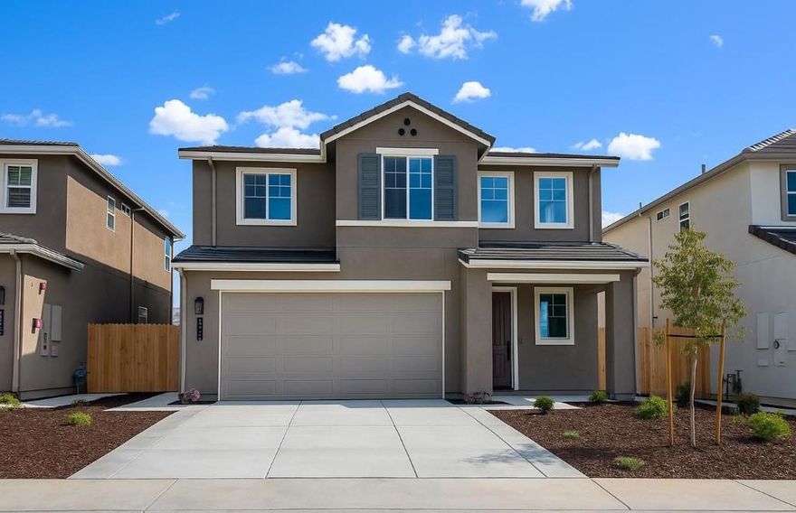 This stunning home combines modern style with everyday comfort, offering bright open spaces and thoughtful details throughout. Popular highlights include an abundance of natural light, a spacious primary bedroom suite, and an open great room ideal for gatherings. From the welcoming covered porch, step inside to soaring ceilings and a striking staircase filled with natural light. The first floor features a convenient powder room, an expansive great room, and a gourmet kitchen with generous counter space for meal prep and entertaining. The kitchen showcases elegant white quartz countertops, an upgraded backsplash, luxury vinyl plank flooring throughout the first floor, and shaker-style cabinets in a rich slate custom stain. Upstairs, the naturally lit staircase leads to two spacious secondary bedrooms, a full bathroom, a convenient laundry zone, and a luxurious primary suite. The suite features dual vanities, a walk-in shower, and a large walk-in closet. Additional home features include drought-tolerant front yard landscaping, energy-efficient central air conditioning, pre-plumb for a soft water system, and a textured and painted garage. With comfort, efficiency, and style built in, this home is ready to welcome its new owners!