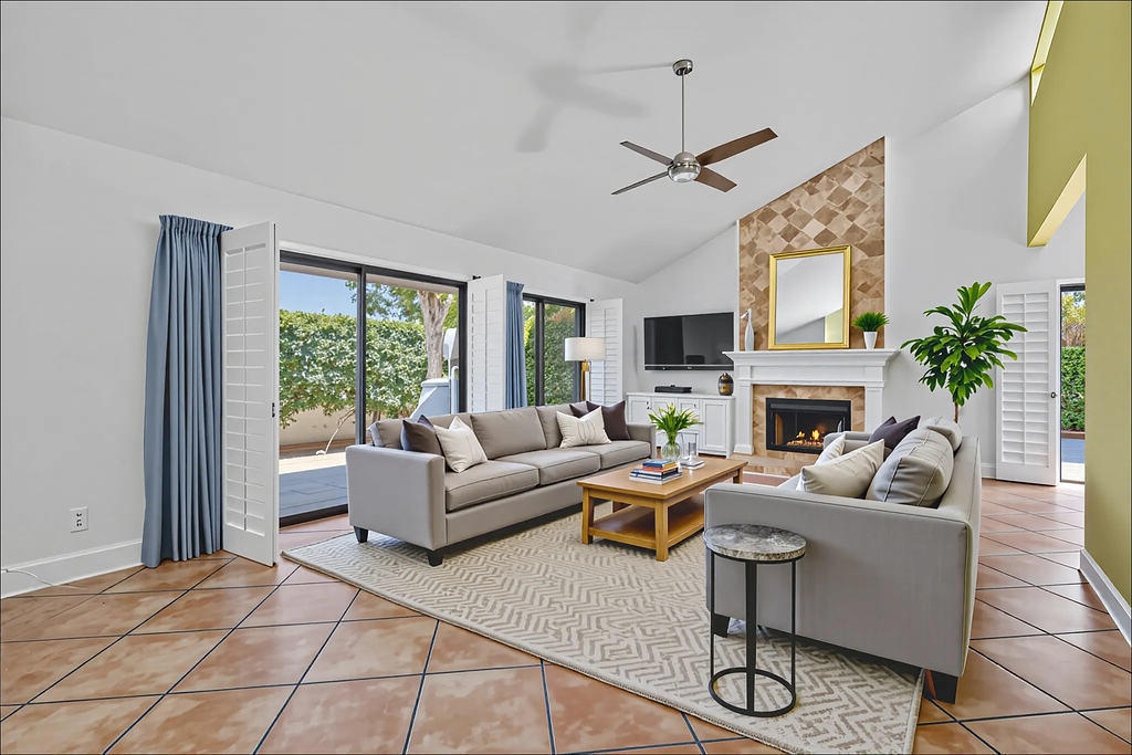 Welcome to your new home in Kings Point Villas designed by renowned modernist architect Hugh Kaptur. This 2 bedroom, 2 bath condo features a large living room with tiled fireplace, soaring ceilings and clerestory windows. The kitchen has been tastefully updated with new cabinets and quartz countertops. The spacious primary suite features an updated bath and dressing area as well as a large walk-in closet. The guest bedroom has direct access to the updated main bath. Enjoy outdoor living from either of your two main patio areas with mountain views. Double garage with direct access into laundry area equipped with washer/dryer. The community features a sparkling pool at the end of each cul-de-sac as well as tennis courts. Located just minutes away from El Paseo, shopping, dining and hiking trails. Welcome home to your new historically designated condo!