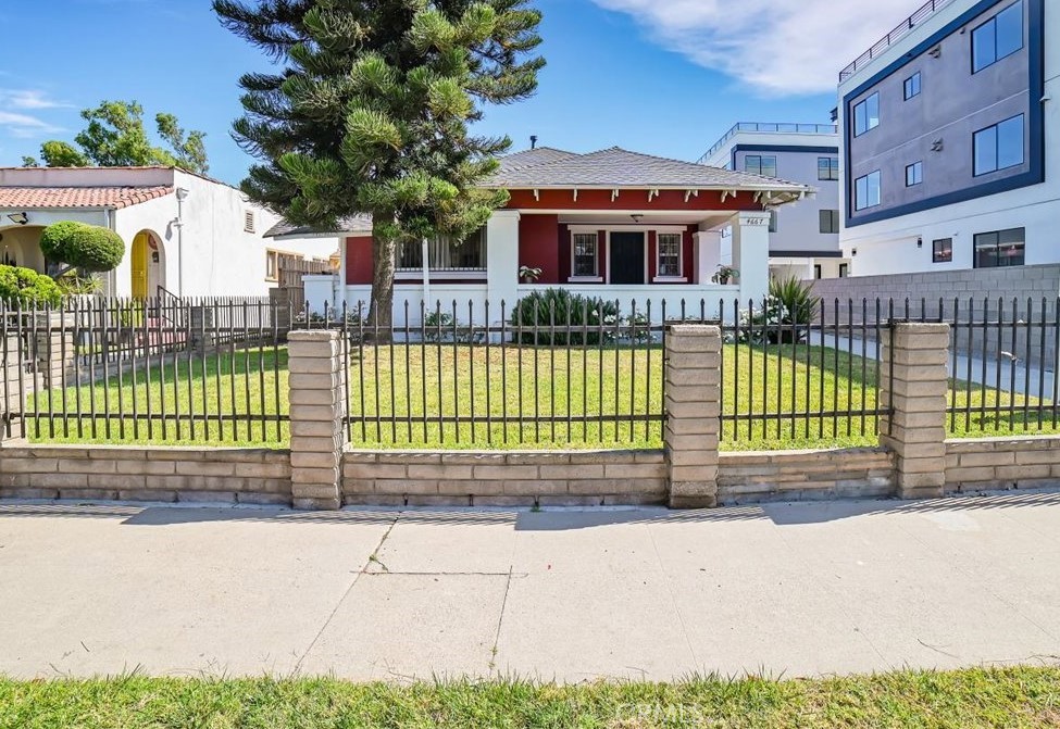 Beautiful remodeled 1912 Craftsman oozing with charm and character. Adorable front unit in duplex style residence with enchanting oversized front porch and gated grassy yard ideal for Al-Fresco dining or just relaxing with your favorite book or pad and your favorite beverage. Exquisite period detail finishes with impressive large crown moldings, baseboards, window and doors with wood framing and casings. Fantastic spacious public rooms filled with an infusion of light and framed by beautiful hardwood floors. Remodeled bathroom with tiled shower and floors. Well-appointed primary bedroom and a secondary bedroom/office. Flexible floor plan with stunning large living room and gorgeous sumptuous formal dining room. Updated large eat in kitchen with granite countertops and tiled floors. Includes interior stackable washer and dryer, stove, refrigerator and microwave, double pane windows and 1 car parking in back. 2 newer window AC units available for your comfort, 1 in primary bedroom and the other in the living room. Front porch views of front yard and Mascot Park/greenbelt island and trees across the street. Excellent Mid-City central location near Pico and La Brea and close to 10 freeway, downtown Los Angeles, Wilshire-Fairfax area, shopping centers, schools, restaurants and public transportation. Welcome Home!