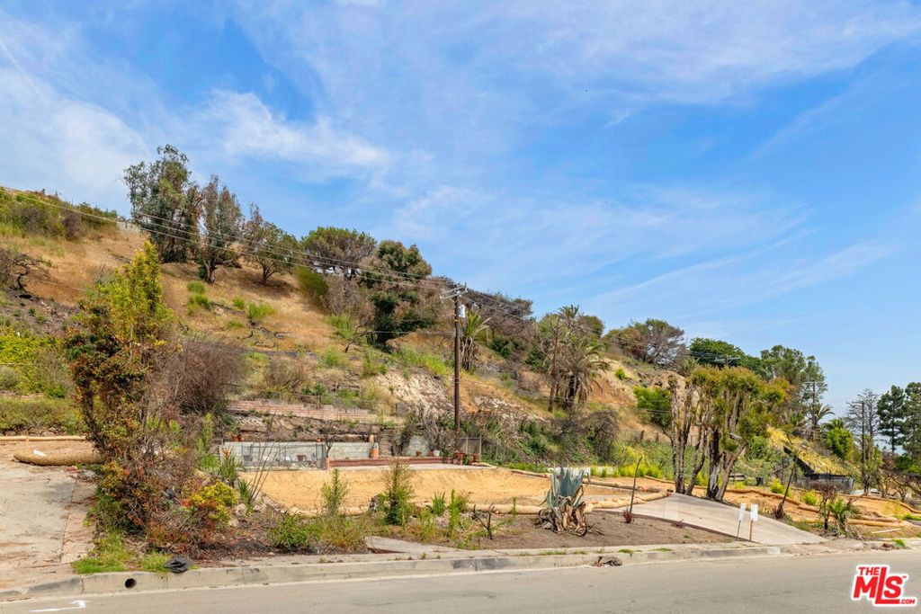 Set on a rare 12,673-square-foot lot in the desirable Marquez Knolls neighborhood, this property offers the perfect canvas to build your dream home. Once home to a 2,034-square-foot single-family residence with 3 bedrooms and 2 bathrooms, the lot's elevated setting provides sweeping ocean views and endless design potential. Located just minutes from award-winning Marquez Charter Elementary, scenic hiking trails, Palisades Village, and the beach, this property combines natural beauty with everyday convenience. A unique chance to create a custom home in one of Los Angeles' most sought-after coastal communities.