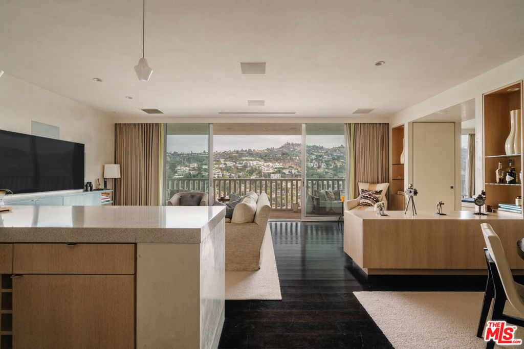 Perched high above the city at 9255 Doheny Road, Residence 2603, this rare offering presents a chance to own in the iconic Sierra Towersthe most prestigious high-rise in Los Angeles. Rising 10 stories higher than any building within a two-mile radius, the 26th floor delivers a vantage point unlike any other, where sweeping, unobstructed views stretch across the city skyline and into the natural beauty beyond.Originally envisioned by legendary architect Jack A. Charney, the tower is an emblem of timeless design, and this residence embraces his vision with a modern refresh. Clean lines, minimal sophistication, and midcentury modern influences create a contemporary yet warm aesthetican effortless blend of style and livability.Inside, 1,315 square feet of open living space is flooded with natural light. Floor-to-ceiling glass pocket doors connect the indoors to an expansive private terrace, seamlessly extending your living space into the sky. The one-bedroom, one-and-a-half-bathroom layout offers the perfect balance of scale and function, ideal for those seeking a pied--terre, a lock-and-leave winter retreat, or a sophisticated downsize with minimal upkeep.