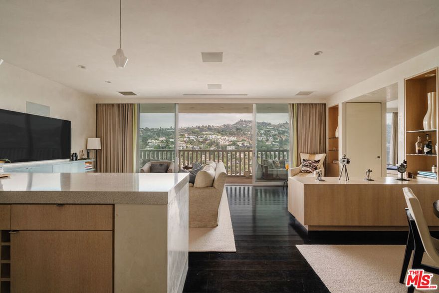 Perched high above the city at 9255 Doheny Road, Residence 2603, this rare offering presents a chance to own in the iconic Sierra Towersthe most prestigious high-rise in Los Angeles. Rising 10 stories higher than any building within a two-mile radius, the 26th floor delivers a vantage point unlike any other, where sweeping, unobstructed views stretch across the city skyline and into the natural beauty beyond.Originally envisioned by legendary architect Jack A. Charney, the tower is an emblem of timeless design, and this residence embraces his vision with a modern refresh. Clean lines, minimal sophistication, and midcentury modern influences create a contemporary yet warm aesthetican effortless blend of style and livability.Inside, 1,315 square feet of open living space is flooded with natural light. Floor-to-ceiling glass pocket doors connect the indoors to an expansive private terrace, seamlessly extending your living space into the sky. The one-bedroom, one-and-a-half-bathroom layout offers the perfect balance of scale and function, ideal for those seeking a pied--terre, a lock-and-leave winter retreat, or a sophisticated downsize with minimal upkeep.