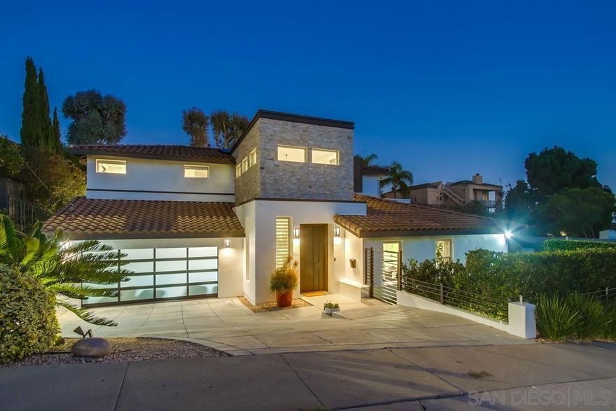 Modern coastal Home, recently remodeled, in LA JOLLA.  This stunning 6 bedroom, 6.5 Bathroom home offers an ideal layout with 2 bedrooms on the main level and 4 upstairs. The primary suite features partial ocean views and a fireplace. The spacious floor plan includes a brand new constructed playroom/pool room with its own full bathroom, perfect for entertaining or guest use.  Professionally designed, this exquisite home features rare upgrades like; Stone finished walls in foyer and bathroom, Seamless Walnut Texture kitchen cabinets with sandblasted glass doors and white macaubas and dark gray quartzite counter-tops.  Stairs are made from steel structure and covered with Oak Wood with stainless steel handrail and tempered glass. Window coverings are dual neolux with motorized roman shades in Master Bedroom. Enjoy the convenience of key-less entry system with Ring doorbell. Take in the sun at the pool, completely renovated. You will truly enjoy touring the decor and openness of this magnificent home, designed for comfort and entertaining, this home blends modern upgrades with coastal charm.