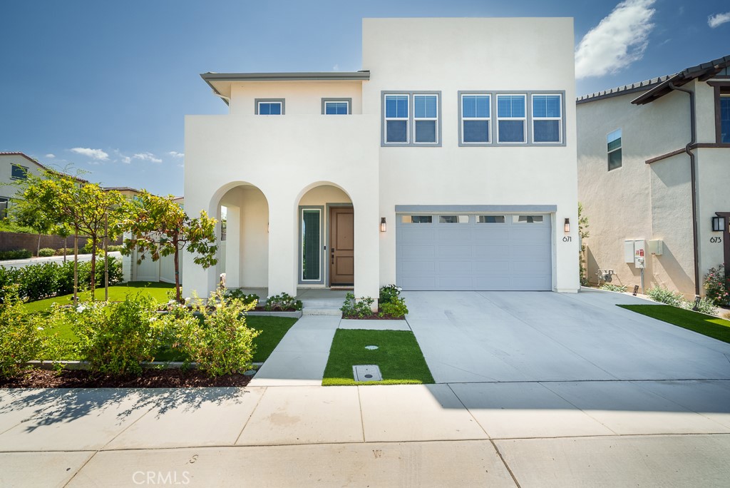 Discover contemporary living at its finest in one of San Marcos’ most sought-after newer gated communities—Mission Circle. Situated on a premium corner lot, this stunning 3,151 sq. ft. home—built in 2022—boasts one of the larger backyards in the community, offering exceptional outdoor space rarely found in newer developments. Inside, you’ll find a seamless blend of luxury, comfort, and flexibility. The open-concept floor plan features 10-foot ceilings and is flooded with natural light. Luxury vinyl plank flooring flows throughout the main living areas, leading to a gourmet kitchen with quartz countertops, stainless steel appliances, a large center island, and a walk-in pantry. The inviting living room is pre-wired for surround sound, making it ideal for immersive movie nights or entertaining guests with high-quality audio. The spacious primary suite serves as a private retreat, complete with a soaking tub, walk-in shower, and dual vanities. Additional bedrooms and bathrooms are thoughtfully designed for both functionality and style, ideal for families of all sizes. Built with energy efficiency in mind, the home includes a tankless water heater, 21 solar panels, smart-home features, and high-speed fiber internet. Enjoy exclusive access to resort-style amenities including a pool and spa, dog park, tot lot, and picnic areas, all within a secure, gated community. The location offers unmatched convenience—just minutes from North City, Restaurant Row, Costco, shopping, dining, hospitals, and major freeways (I-78 and I-15). Families will love being close to Discovery Elementary, San Marcos High School, CSUSM, and the prestigious Pacific Ridge School.