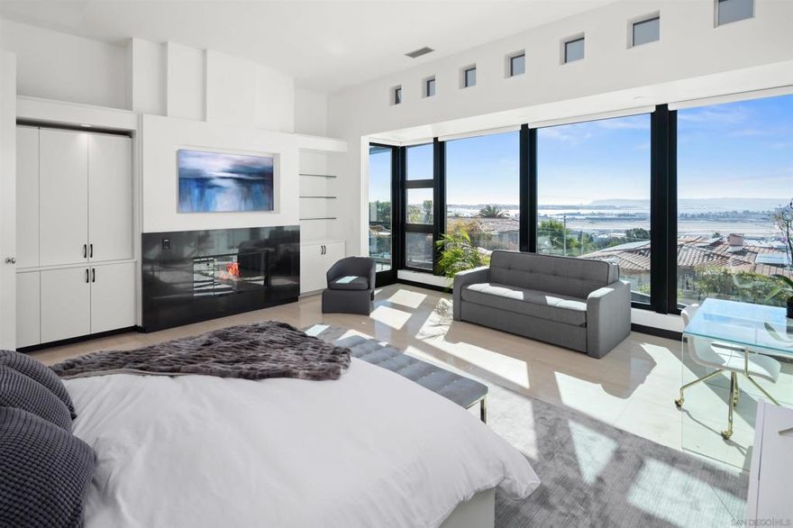 Luxury Retreat in Mission Hills with Breathtaking Views  Experience elevated living in this stunning 4,600 sq. ft. home, perched in the prestigious Mission Hills neighborhood of San Diego. Offering panoramic views of San Diego Bay, the ocean, and Point Loma, this residence is designed for relaxation, entertainment, and unforgettable moments.  Wake up to breathtaking scenery from the expansive master suite, complete with a spa-like en-suite featuring a jetted tub, a fireplace, and exquisite Onyx detailing. The gourmet kitchen is a chef’s dream, perfect for preparing meals while taking in the city’s most spectacular sunsets.  Entertainment is effortless with a state-of-the-art game room, designed to create the ultimate experience. Enjoy a movie theater atmosphere, featuring a pool table, vintage Pac-Man arcade, popcorn machine, wine cellar, and a large projector screen with full gaming and streaming capabilities.  Step outside into a one-of-a-kind backyard retreat, boasting a 6-person jacuzzi, a spacious deck for entertaining, a BBQ grill, and a cozy fire pit—ideal for evenings under the stars. Indoors, unwind in plush surroundings, multiple fireplaces, soft blankets, and a warm, inviting ambiance.  Additional amenities include:  Complimentary continental breakfast & Nespresso coffee  Smart TVs, Apple TV, Sonos surround sound, and high-speed WiFi Keyless entry for seamless access Ample parking & a massive walk-in closet  Discover the perfect blend of luxury, comfort, and entertainment in one of San Diego’s most sought-after locations.