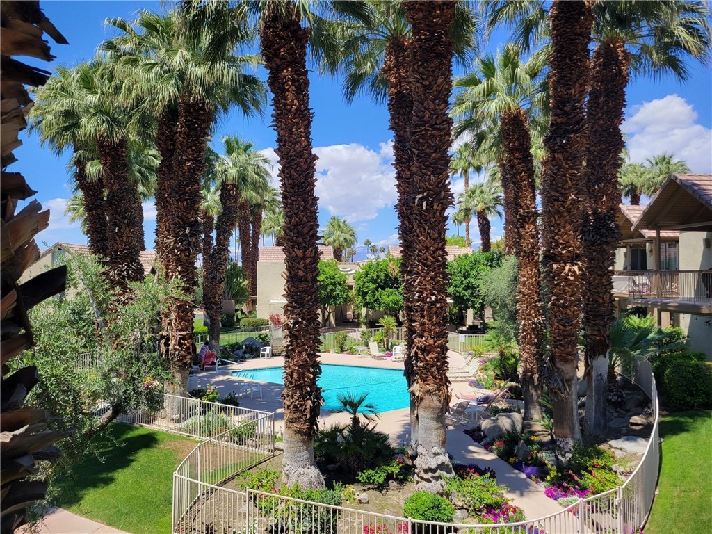 Why #53 is the place to be? Pool views and Mountain views! from this two story tree house top oasis where you can see it all! Snack time? This full size designer kitchen with all the upgraded appliances featuring Samsung white glass (changeable glass colors can be ordered) with water dispenser and pitcher in hidden door. Gorgeous! Samsung range is multi-functional Bake, Air-Fry, Convection Oven/Roast, Broil, Bread, Etc. it does it all and of course the range hood had to be spectacular with black stainless steel and glass (3 modes and lights) Enjoy the breezes from the balcony and eat, drink and be merry. Paradise found. Upgrades to the bathroom have improved the elegance of the original stone counter tops with new backsplash, modern mirror and copper accents. The skylight in the shower with pebble tile floor helps to ground you back to nature, making you so relaxed, you will never leave. Stackable washer/dryer is in the unit for convenience plus bottom of the stairs is the community laundry. Living room is spacious with vaulted ceilings and modern fans. For those who have to check in for a bit of work will find the office space tucked in behind the swinging door. (no running to Staples for a quick copy or scan). So ask yourself, why #53? Heart and center of the community, best views, fabulous kitchen, outstanding appliances and Oh, a quick stop at city hall and a few bucks and you are now on the social events email for Indian Wells residences and discounts. (Meet and greet events great for newbies, tennis tickets, zoo tickets, golf, concerts, etc. Get your steps in and walk over to the Cliff house, Vue or Berr Hunter! Vues 2 miles for those who are pro walkers! Open, bright and spacious. A perfect place to call home or a great short term rental! It will pay for itself and all just for $347,900. WOW !!!