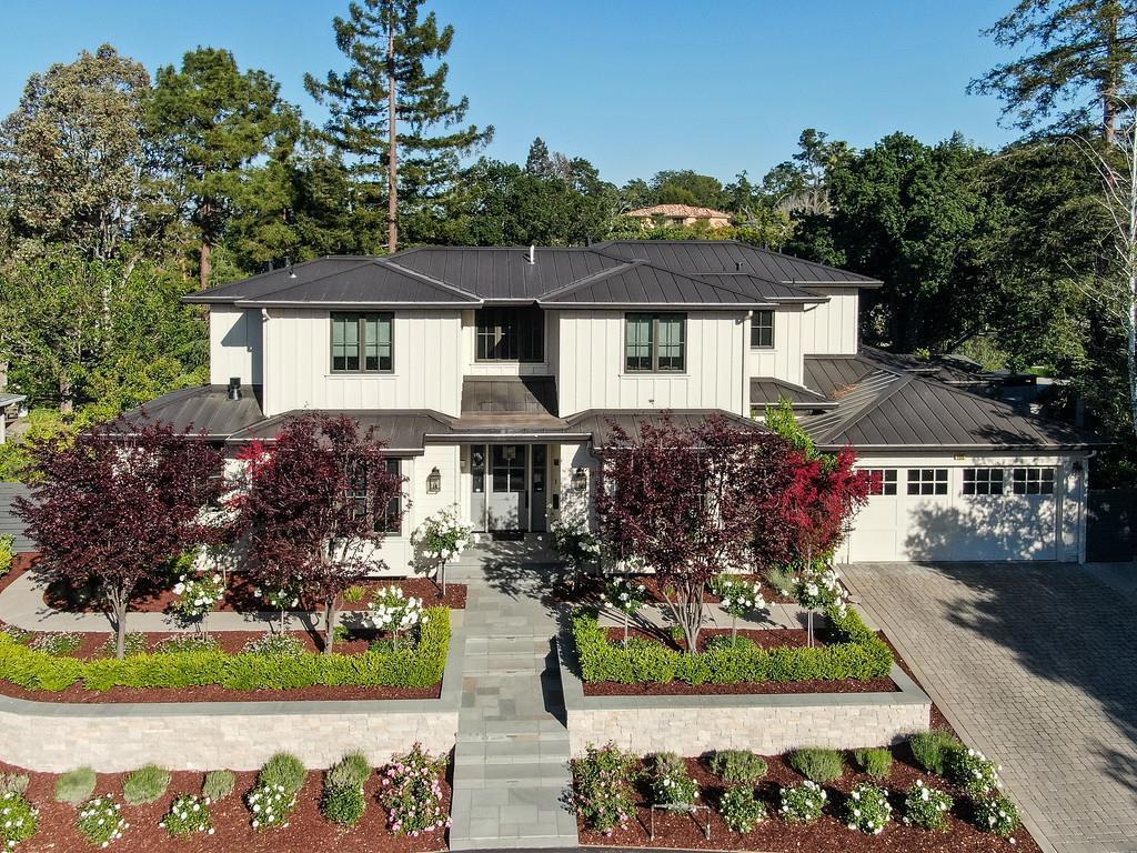 This five-star home in Sharon Heights was built to perfection in 2018 with three elevator-connected levels in a private setting of almost a third of an acre. Quality shows in the White oak floors, shiplap-paneled ceilings, refined millwork, designer lighting, glass door knobs, and automated lighting & window coverings. The extra-large floor plan features 7 bedrooms, 7.5 baths plus an office, with bedrooms on each level to meet every lifestyle need. The main level is graced by formal rooms and a tremendous great room with chef's kitchen & family room, under 14 foot ceilings, that opens to the outside thru folding glass doors to the huge sport court, built-in barbecue center & fire pit. The primary suite & couture closet, plus three additional suites, are located on the upper level. Recreation & media features continue on the lower level, along with two additional bedrooms and two baths, a full bar, kitchenette, and custom wine cellar. All just minutes from excellent Las Lomitas schools.