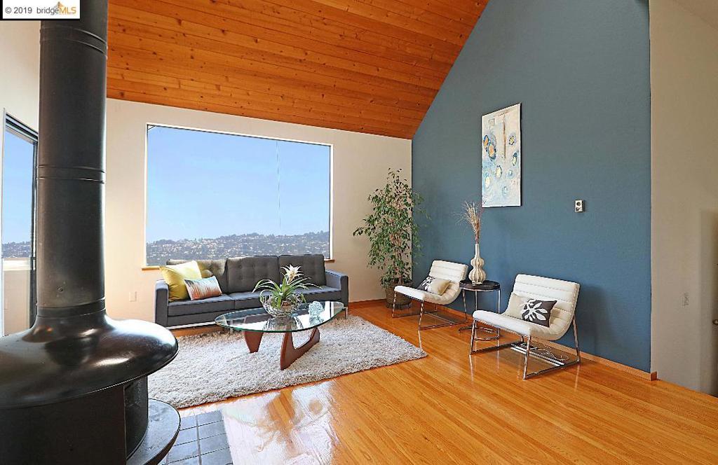 Amazing, light-filled, spacious (1522 s.f.) 3 bedroom, 2 bath condo with unstoppable view of the East Bay Hills. Living room with high wooden ceiling, hardwood floors, free standing fireplace and east-facing picture window capturing the panoramic view of the hills. Separate dining room also with hardwood floors, ceiling fan, and slider to east facing balcony. Modern Kitchen with granite topped island, stainless appliances, and extra storage plus pantry. Downstairs are 3 spacious bedrooms including the large master with its own bathroom, walk-in closet and alcove sitting area. In unit hall laundry closet. Sewer lateral compliant. Location is a cul-de-sac leading to the Albany Hill trailhead.