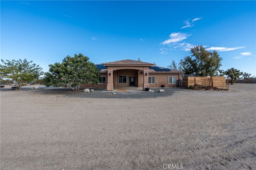 Welcome to amazing ranch style home in Pinon Hills CA with PAID OFF SOLAR. This move in ready home offers 4 bedrooms 3 full baths and beautifully built high ceilings to provide space and a welcoming feel.  The home offers 2,452 of Sq Ft with ample space for the family. This well maintained home offers an enormous covered patio to enjoy family gatherings or a tranquil afternoon. The lot size provides 2.08 acres of flat land to enjoy the outdoor activities and much more! Close to the 138 highway for an accessible commute. Corner parcel, fully fenced. Located in the Snow Line School District and zoned for horses. Come take a look at this beautiful home!