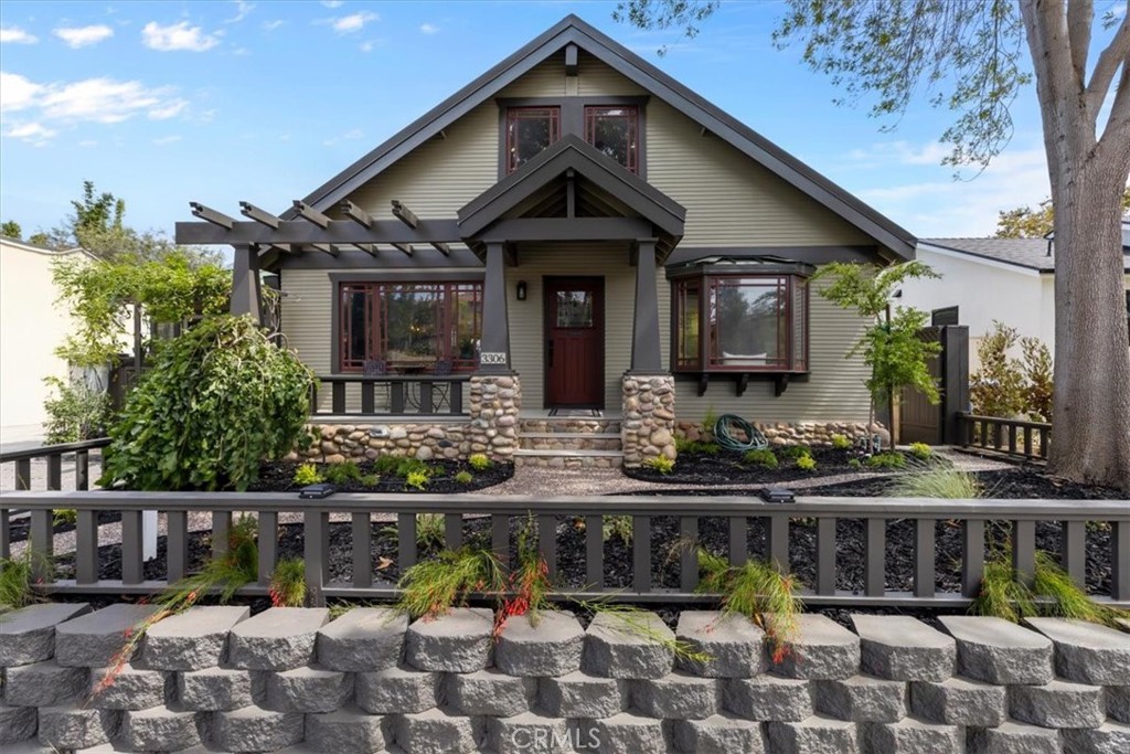 This Craftsman Bungalow perfectly blends historic charm with modern upgrades, offering 3 bedrooms, 4 bathrooms, and a detached ADU studio across 2,713 sqft. The 1,996 sqft. main home features a light-filled living room with a large garden-view window, a dining area, wood-paneled walk-in bar, and a chef’s kitchen with imported 43” La Cornue range, granite counters, new stainless appliances, and a spacious pantry. A flex room near the living room adds bonus space, while the central staircase naturally divides the main floor. Downstairs includes two bedrooms and two skylit bathrooms. The primary suite offers double closets, French doors to the backyard, and a spa-like bathroom with shower, clawfoot tub, and single vanity (with the option to add a dual-sink vanity). Upstairs, a vaulted-ceiling bedroom offers oversized storage (6’ x 14’), while the loft provides even more storage (two 6’ x 24’ areas) and soaring ceilings. The detached 717 sqft. ADU studio adds flexibility with its own entry, open floor plan, vaulted ceiling, kitchen with butcher block counters and built-in bar, ceramic sink, dishwasher, and French doors to the garden. It also includes a spacious bathroom with shower and stackable washer/dryer, deep closets, and a mini-split for comfort. The backyard is a true oasis - lush, private, and designed for entertaining. Enjoy 800 sqft. of outdoor living with porches, decks, and an arbored patio centered around a stone fireplace. A jacuzzi tucked among mature fruit and nut trees (banana, avocado, citrus, apple, macadamia, and cherry) creates a resort-like retreat, while thoughtful landscaping offers both beauty and seclusion. Major system upgrades include copper plumbing, ABS sewer, dual on-demand water heaters, insulation, and solar power with water heating. All this just minutes from the freeway, Dale Page Park, and neighborhood favorites like Panelas Brazil Cuisine, a cozy café, and a local cookie shop.