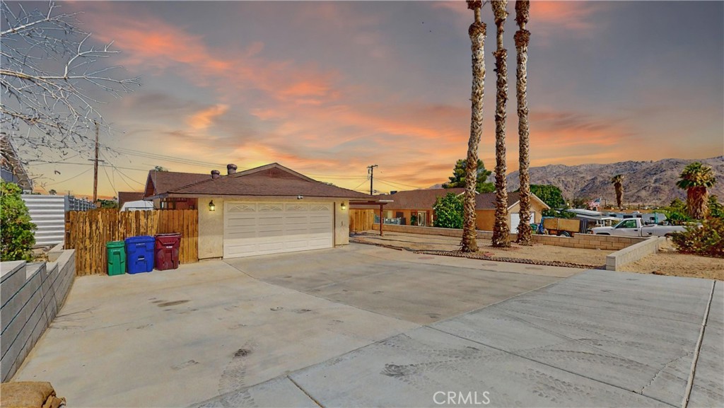 Clean and modern single-story home featuring 2 bedrooms and 2 bathrooms on a spacious 7,200 sq ft lot. This well-maintained property offers a cozy fireplace for cool desert evenings, stylish laminate and stone flooring throughout, and a thoughtfully cared-for kitchen with stainless steel appliances. The large driveway provides ample space for multiple vehicles or recreational toys. The backyard includes a convenient storage shed, and there is an easement separating the property from the one behind it—adding an extra sense of space and privacy. Move-in ready—just bring your belongings and relax!