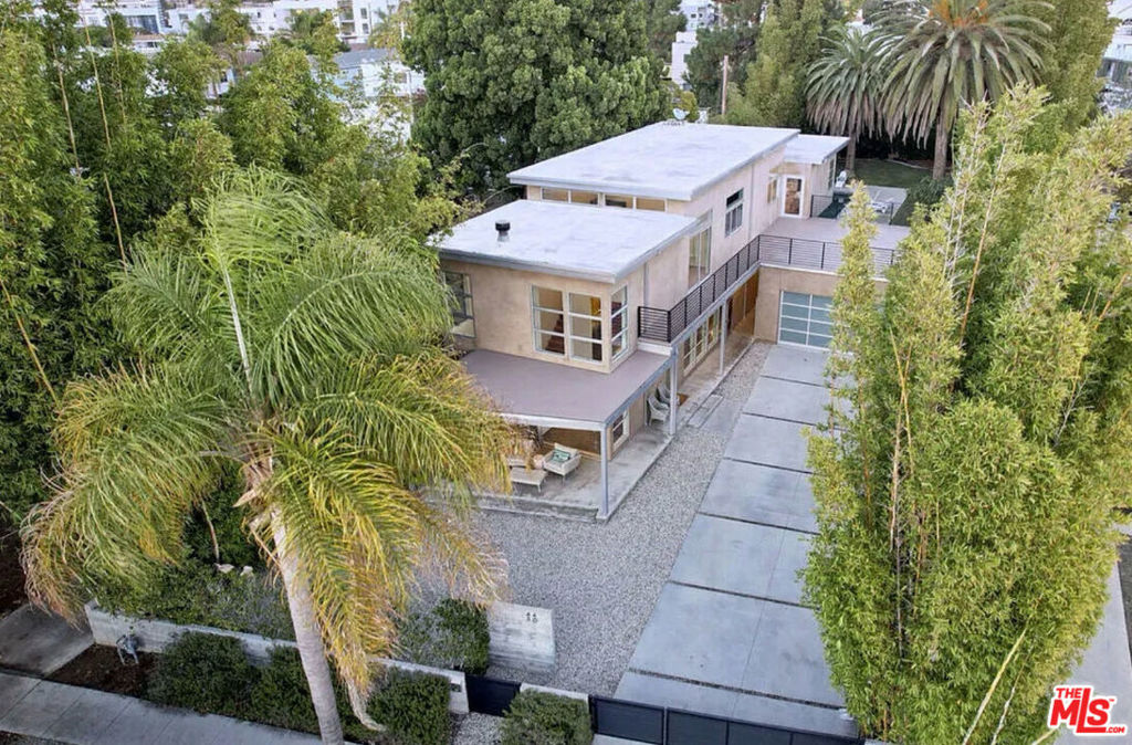 Experience one of Del Rey's rarest offeringsa striking architectural home set on a massive 13,600 sq. ft. lot with a resort-style pool and expansive park-like backyard. This property delivers the perfect balance of modern design, space, and serenity right in the heart of the Westside.Inside, dramatic high ceilings and floor-to-ceiling windows flood the home with natural light, creating a bright and welcoming atmosphere. The open-concept layout flows effortlessly, starting with a spacious living room featuring clerestory windows and a sleek fireplace centerpiece. The first floor boasts polished concrete floors with radiant heat, leading into a chef's kitchen with Caesarstone counters, walnut cabinetry, oversized island, and top-quality appliances including Wolf and Viking.Walls of glass open directly to the backyard, where you'll feel as though you've escaped to a private retreat. Upstairs, natural wood floors add warmth, complemented by a flexible loft space and a large sun deckideal for lounging, entertaining, or morning yoga.This home is designed for comfort and style, offering an unmatched opportunity to enjoy both indoor luxury and outdoor living. A rare find in Del Rey, ready for you to move in and make it your own.