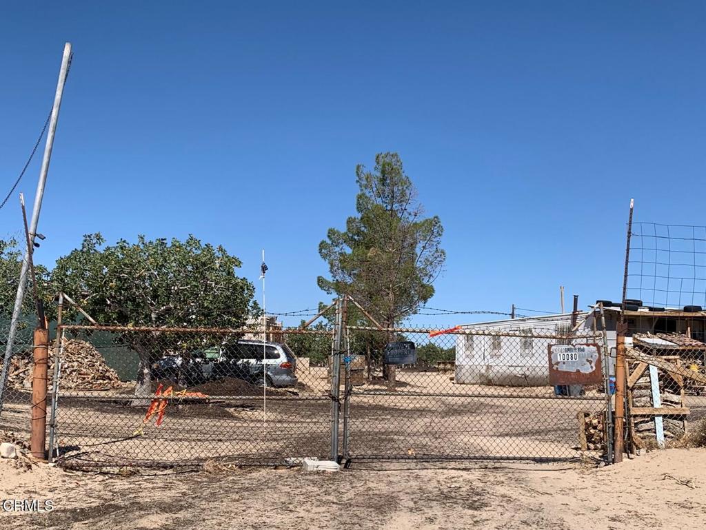 This is a great opportunity you won't want to miss--thanks to the current pistachio supply shortage, running this farm will be easier than ever, and with good management, your income can keep growing steadily. Plus, the price is just right! This property offers a 2-bedroom, 2-bathroom 924 sq ft mobile home (livable but needs some TLC) on a fully fenced, income-producing 39-acre pistachio orchard with about 1,500 mature trees, three greenhouses, a private well, and 20 acre-feet of water rights. Included are essential farming tools and equipment such as a Suzuki 4-wheel utility vehicle, welding machine, generator, shaker, and 600 tons of fertilizer. The farm also has a transport truck. Located close to a paved road, it provides easy access and a quiet, clean-air rural lifestyle in Lucerne Valley. Well-equipped for efficient operations, this farm offers great potential for growth under new ownership. A 50-year T-Mobile lease generates $20,000/year from a 1,600 sq ft southeast corner site. Two tractors and five storage containers aren't included but can be purchased separately. The property includes three parcels: APNs 0449-563-19, 0449-563-20, and 0449-563-13.
