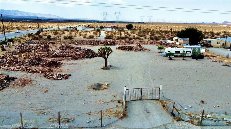 Welcome to a 1.65 acre vacant lot offering the perfect blend of space, convenience, and potential.Situated right off Highway 18 not far away from paved access, this vacant lot is ideal for those looking to build their dream home, a desert retreat, or a long-term investment.
Water, power and gas are just around the corner, making future development more cost-affective. Enjoy the prime location in its amazing views of desert and stunning mountain backdrops. Pinon Hills is a growing community.