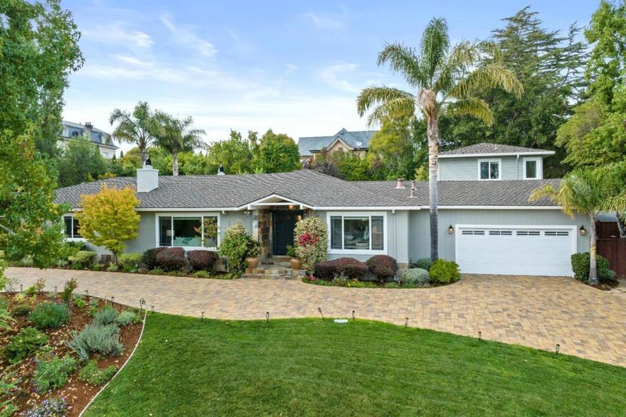 Introducing 585 Remillard Drive, Hillsborough, CA: a synthesis of luxury and refined Californian living. Spanning 4,214 sq ft, the main home invites with 4 bedrooms, 3.5 baths, and a spectacular chefs kitchen, embodying an aura of opulent design and functionality. An attached guest house provides 2 additional bedrooms, 1.5 baths, and a full secondary kitchen, with French doors revealing a bridge to lavish outdoor living. On a 22,000 sq ft lot, the backyard unfolds a mesmerizing oasis: exotic palm trees, impeccable landscaping, a cutting-edge pool and hot tub, and elite outdoor entertaining amenities. A resplendent offering where every detail narrates a story of luxury.