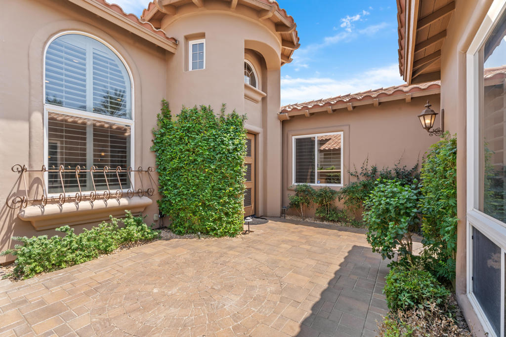 Your ultimate Desert retreat awaits with this exceptional Encanto II estate at Rancho La Quinta Country Club, offering 4 bedrooms and 3.5 bathrooms, including a private, detached two-bedroom casita. Step into refined desert living with travertine flooring throughout the main spaces and baths, complemented by newer bedroom carpeting. The gourmet kitchen features stunning quartzite counters, a custom glass tile backsplash, and stainless appliances--a perfect canvas for the discerning chef. The outdoor sanctuary is designed for grand entertaining around the shimmering free-form pool on an expansive patio. Enjoy spectacular, uninterrupted golf and lake views down the 14th hole of the renovated Jones course, framed by the dramatic Chocolate Mountain Range--indoor-outdoor living perfected. Rancho La Quinta Country Club offers a world-class environment. A Sports Membership is included with HOA dues, granting immediate access to the vibrant tennis and pickleball facility, pool complex, fitness center and the highly anticipated renovated clubhouse slated for completion mid-season. This is a rare, turnkey opportunity to acquire a premium, low-maintenance luxury lifestyle.