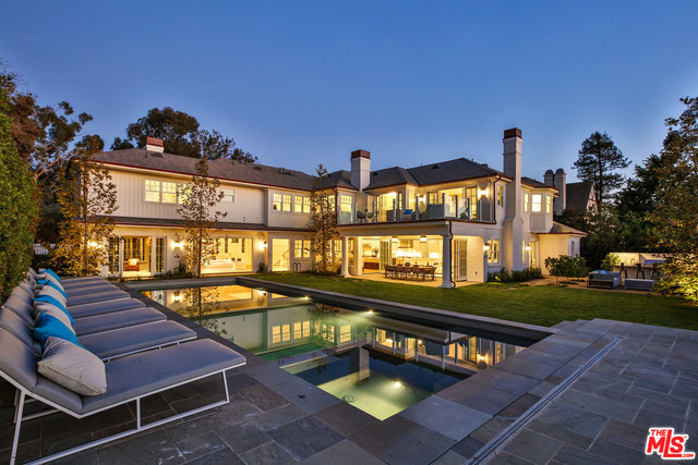 Outstanding new construction. Luxurious East Coast traditional melds seamlessly into modernized farmhouse vernacular creating an elegant yet comfortably informal living experience. This superb Ken Ungar design exemplifies a bright open floorplan with walls of doors that fold away for a naturally intuitive indoor/outdoor flow. Enjoy alfresco dining, the BBQ center, pool deck areas with water features & fire pit as your own personal resort. Gravitate to the kitchen with triple islands which navigate easily for convivial mingling while meals are made. There are 7 bedrooms with 5 on the upper level, including a kid's wing with separate playroom/study. The master wing is introduced by a vestibule & has adjacent sitting room & a generous terrace with a view. The main floor has an office/den, formal dining room & living, kitchen/great room, pool room & maids. The lower level has the gym, wine room, game room & bar, home theatre & guest room. This is the ultimate in luxury lifestestyle.