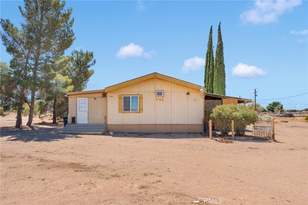 This amazing 2 bed, 2 bath home in Oak Hills offers the perfect mix of comfort, space, and convenience. Nestled on a generous 2.5-acre lot in a quiet neighborhood, the property sits just off a short dirt road from a main paved road, providing both privacy and easy access. Enjoy stunning mountain views and quick access to the freeway, making commuting a breeze. Located within the Snowline School District, it’s an ideal choice for families seeking quality education nearby. With Home Depot and Walmart just minutes away, and Costco only 20 minutes out, shopping and essentials are always within reach. Whether you're looking for room to grow, space to relax, or a peaceful desert retreat with modern conveniences close by this property checks all the boxes.
