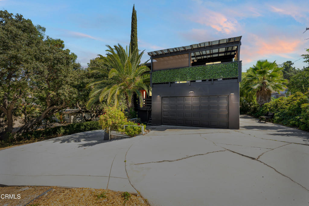 Double lot, 2 APN's!! Welcome to this stunning corner-lot residence in desirable Newbury Park, offering the perfect blend of style, space, and functionality. This multi-level home is thoughtfully designed to maximize comfort and natural light throughout.The first level features two generously sized bedrooms, each with large closets, sharing a full bathroom adorned with a tub and tastefully accented tile walls and flooring. Bathrooms also feature heated towel racks, adding a touch of spa-like luxury to your daily routine.Upstairs, the main living area boasts soaring ceilings, an abundance of natural light, and an eye-catching accent wall in the open living room, ideal for both relaxing and entertaining. The bright white kitchen seamlessly opens to the family room and is a chef's dream, complete with quartz countertops, ample cabinet storage, a beautiful backsplash, gold hardware, a wine refrigerator, a convenient breakfast bar, and a sleek touch-free faucet for added convenience and hygiene. Step out onto the large private balcony, perfect for morning coffee or evening gatherings.Also on this level is the spacious master suite featuring a private en-suite bathroom with a walk-in shower and modern finishes.This home has been thoughtfully upgraded with a new water heater installed in 2025, a new furnace and AC system from 2023, and a Tesla solar system added the same year under NEM 2, offering energy efficiency and long-term savings. All new Samsung Bespoke appliances were installed in late 2022 and early 2023, blending high-end performance with stylish design.An outstanding feature of this property is that it sits on a double lot with two separate APNs, giving potential buyers the unique opportunity to build an additional home on the adjacent vacant lot, perfect for extended family, rental income, or future investment.Enjoy outdoor living in the expansive yard with low-maintenance artificial grass, ideal for pets, play, or entertaining guests. A 2-car garage provides additional storage and convenience.Located close to The Oaks Mall, the 101 Freeway, parks, and top-rated schools, this home offers both comfort and a prime location. Don't miss this move-in ready gem!