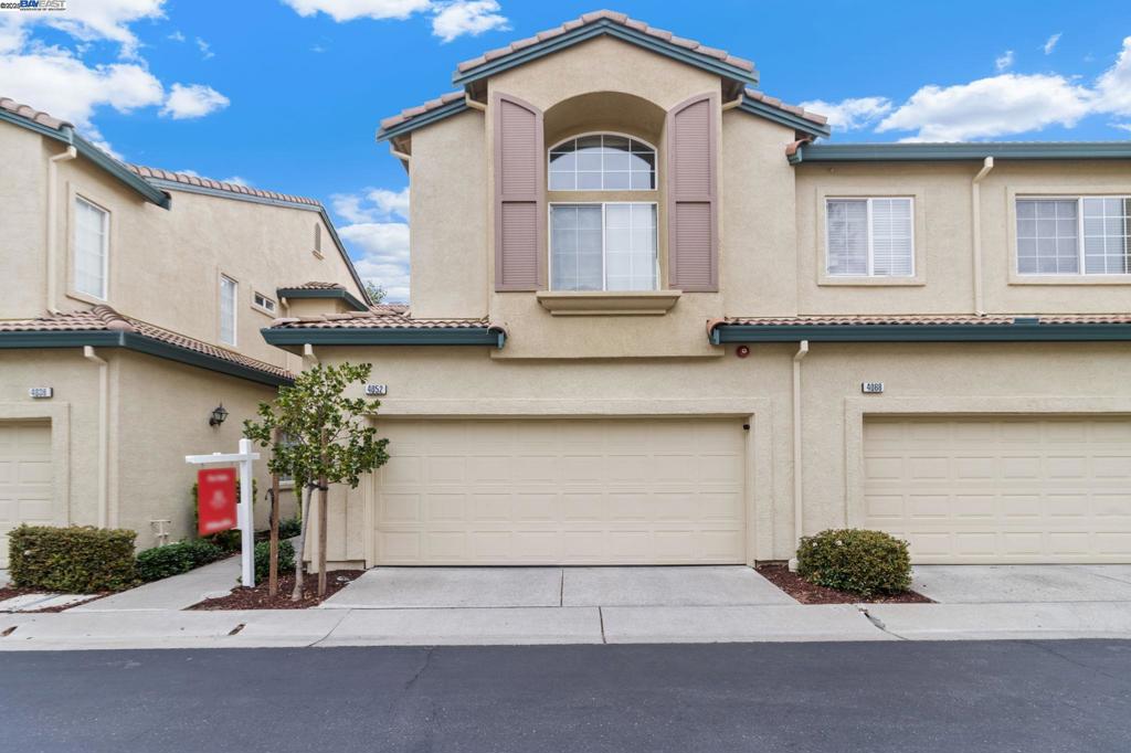 BEAUTIFUL MOVE-IN READY HOME IN A PRIME PLEASANTON LOCATION! Zoned for top-rated schools, this 2 bed, 2.5 bath home is the perfect blend of style and comfort. Step inside to find rich hardwood floors throughout a bright, open floor plan. Over $25k in upgrades, this home features a completely renovated gourmet kitchen, fresh paint, new washer/dryer, new water heater, and a new water softener. The 2-car garage features durable epoxy flooring. The open-concept Great Room is perfect for entertaining, flowing out to a serene backyard with elegant pavers. The spacious primary suite is a perfect retreat. Perfectly positioned within walking distance to BART, Kaiser, and shopping. Minutes from Downtown Pleasanton and ACE Train, with parks and trails just a 5-minute walk away. An exceptional home !!