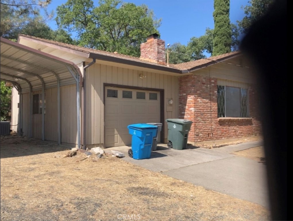 Three bedroom, 2 bath house and adjacent land with shop. The land has two street frontages (Oro Garden Ranch and Edgemont), the house has one sloped, paved driveway. Great location. Appliances included: range, oven, dishwasher. Brick fireplace in the living room. Sliding door to concrete patio for easy backyard BBQs. Freestanding, metal carport between house and land. Attached 1-car garage with opener. Detached shop has concrete floor and garage door opener. So much possibility!