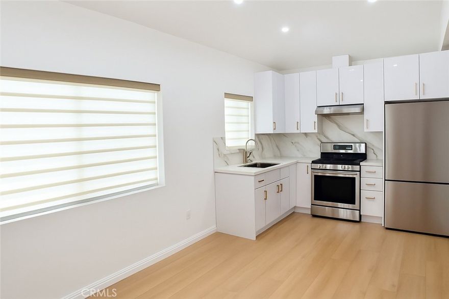 Welcome to this newly remodeled luxury ADU in Sylmar featuring 1 bedroom and 1 bathroom with 450 square feet of stylish living space. Be the very first occupants of this beautiful home, designed with bright interiors, sleek laminate flooring, and a fresh modern layout. The kitchen includes a refrigerator and range, and the unit also comes with the convenience of a washer and dryer. Elegant new blinds provide both privacy and a touch of style, while large windows fill the home with natural light. Comfort is ensured year-round with two wall-unit A/Cs, one in each room. Located on a quiet cul-de-sac, this ADU offers peace and privacy, and all utilities are included in the price for exceptional value. Close to schools, shopping, freeways, and outdoor recreation, this is a clean and low-maintenance home with a no-pet policy. A rare opportunity in Sylmar, it won’t last long.