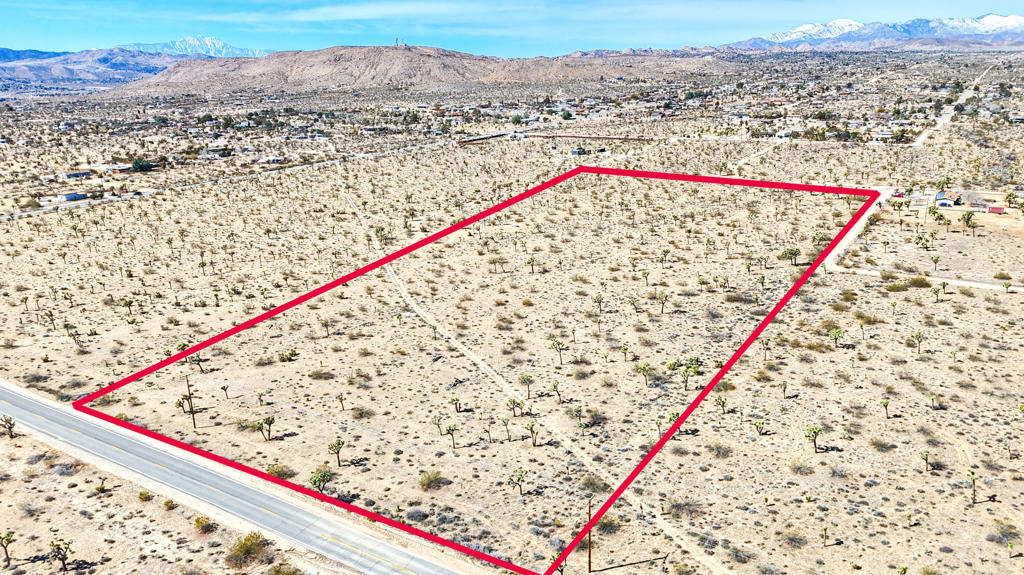Seize the opportunity to own this stunning 5-acre parcel with direct access off Yucca Mesa Road, just minutes from 29 Palms Highway. This lot offers convenient accessibility while maintaining the tranquility of the desert landscape. The flat terrain, adorned with scattered Joshua trees, provides the perfect setting to build your dream home, vacation retreat, or investment property. Expansive desert and mountain views create an awe-inspiring backdrop, while easy access to utilities enhances the property's desirability.For those seeking even more space, three additional 5-acre lots are available for purchase, allowing you to create a sprawling 20-acre estate in this coveted Yucca Valley location. Don't miss this chance to secure your slice of the high desert lifestyle before it's gone! Photo with red outline is all 4 parcels together. Other APNs available: 0598-084-31-0-000, 0598-084-33-0-000, 0598-084-34-0-000.