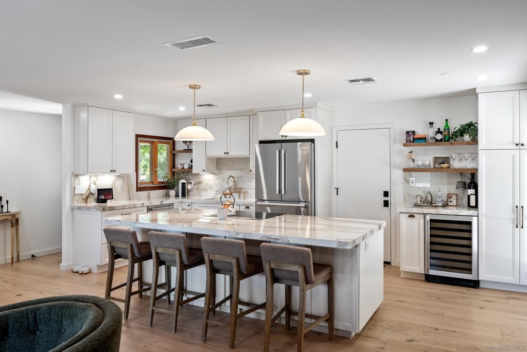 In the heart of Paso Robles’ desirable Westside, just a short walk to downtown shopping, dining, and entertainment, you’ll find this beautifully renovated 3-bedroom, 2-bath single-level home. Offering 1,255 sqft of thoughtfully reimagined living space, this property blends modern upgrades with comfortable California living. Step inside to discover a completely redesigned open floor plan, featuring manufactured white oak wood flooring throughout. The stunning chef’s kitchen is the centerpiece of the home, boasting brand-new appliances, an induction cooktop, a wine fridge, and a massive porcelain island perfect for gathering. Walls were opened up to create seamless flow, while both bathrooms have been fully renovated with tasteful finishes. Outside, enjoy Paso’s warm evenings on the newly built 672 sqft backyard deck, ideal for entertaining, dining, or simply taking in the views. A private sauna adds a touch of luxury and wellness to your daily routine. Additional features include upgraded finishes, stylish fixtures, and proximity to downtown’s vibrant restaurants, wine tasting rooms, and events. Whether you’re looking for a primary residence or a weekend retreat, this home offers the best of Paso Robles living.