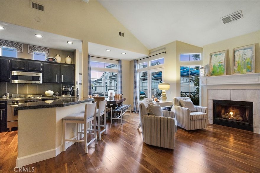 Absolutely one of the finest and most upgraded condominiums located within the highly coveted "Breakers" community of Laguna Niguel. This "Laguna" model, consisting of two bedrooms, two baths, and approximately 1135 ft.² with vaulted ceilings, is truly "open & spacious" as well as "light & bright". This residence is owned by the original owner and has been meticulously maintained… upgrades include Acacia hardwood flooring, as well as crown molding… the master suite includes customized closets with built-in storage as well as smoked glass and bronze sliding doors, a  master bath inclusive of an Italian Marble (Calcutta Oro) walk-in shower with wall to wall niche in addition to a sliding barn door on the master bath with smoked glass & stainless steel hardware. The master suite bath area features custom wooden cabinetry stained in espresso with white quartz countertops, and raised dual sinks. The gourmet kitchen features a modified breakfast bar area with Cambria Quartz countertops, custom tile & backsplash, a stainless steel farmers sink, & dual faucets. Additionally the kitchen boasts stainless steel kitchen appliances, including a Bertazzoni gas range/oven and microwave, Viking refrigerator/freezer and Bosch dishwasher. Included also is a Stainless Steel full-size GE stack washer and dryer. Additional upgrades include a white milled fireplace mantle, and round fire stones for incredible ambience. Central air conditioning, PEX piping, a ChargePoint electric car car charger, a Sensi digital thermostat (cell phone controlled), and Restoration Hardware rods & brackets for window treatments. This residence contains a one-car attached garage with the features of “direct access” into the home and additional storage. Off-street parking is readily accessible. The Homeowners Association amenities include a gated outstanding pool area, as well as two spa areas, but most uniquely, provides a direct "gate access" to the Ocean Ranch shopping center containing a Trader Joe’s, the Cinepolis luxury movie theater, and a host of shopping and dining establishments. This residence is located minutes away from both the Waldorf and Ritz Carlton resorts as well as the Salt Creek Beach with its renowned surfing breaks. Equally close as the Dana Point Harbor with its Lantern District and it’s numerous shopping and dining facilities. This outstanding residence presents phenomenally well and is a must see for all of your discriminating purchasers in this price range.